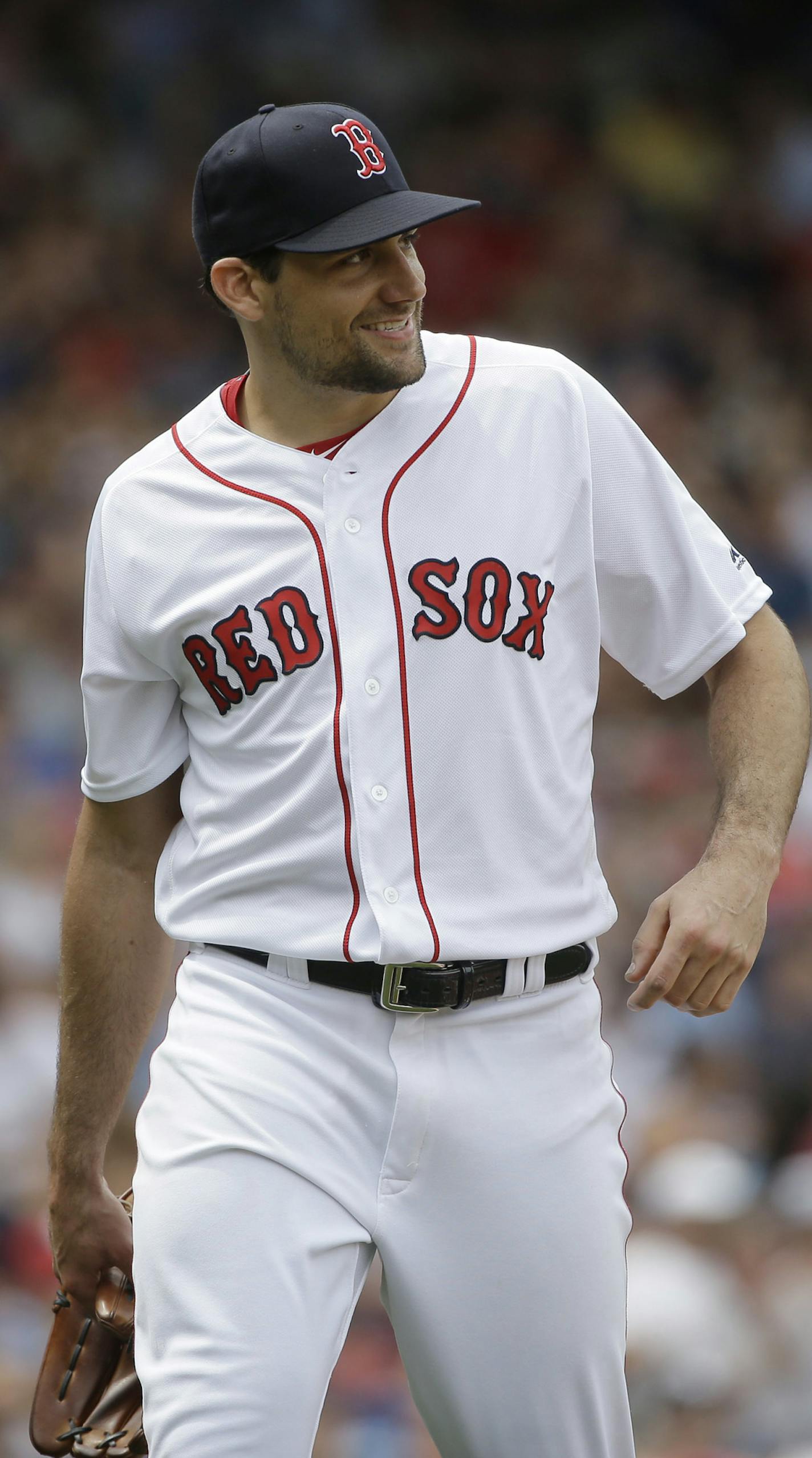 Boston Red Sox's Nathan Eovaldi smiles as he steps off the mound after pitching against the Minnesota Twins in the fourth inning of a baseball game, Sunday, July 29, 2018, in Boston. (AP Photo/Steven Senne)