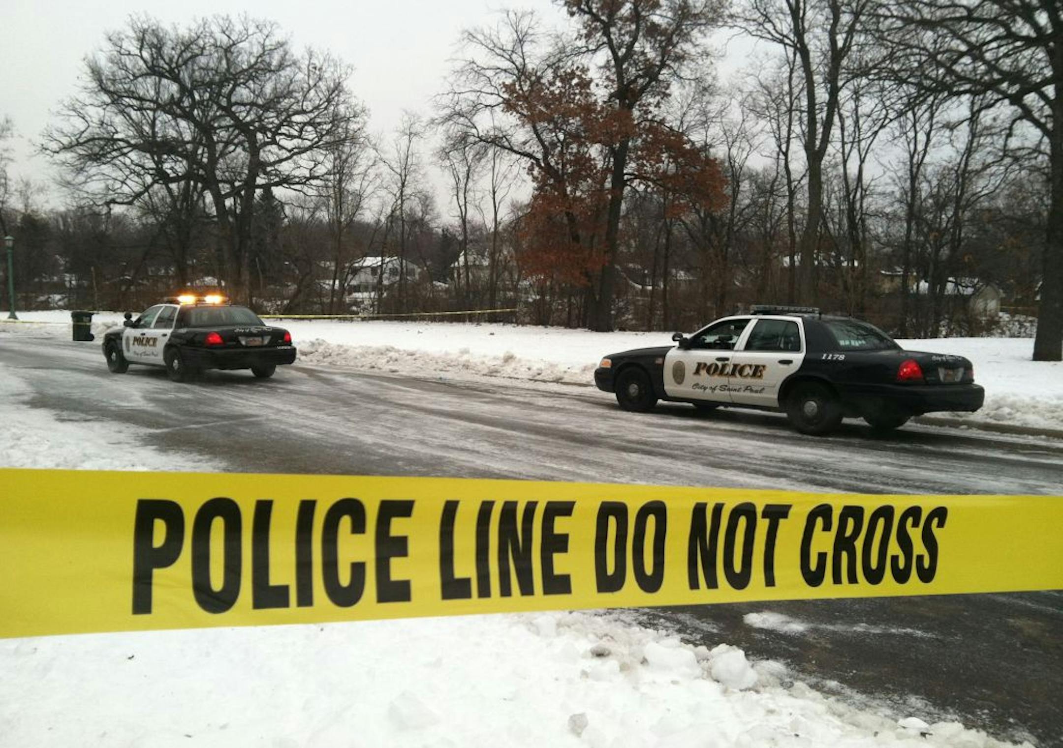 A armed suspect robbed the Kowalski on Grand market and was later shot by St. Paul police. In this photo police search the area near the market on Ayd Mill Road. Monday, 12/17/2012
