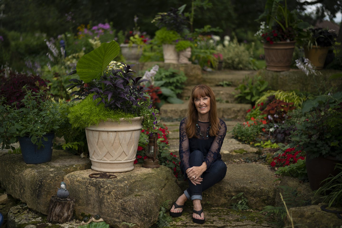 Michelle Riedel's backyard garden in Oakdale includes a pond and stone steps.