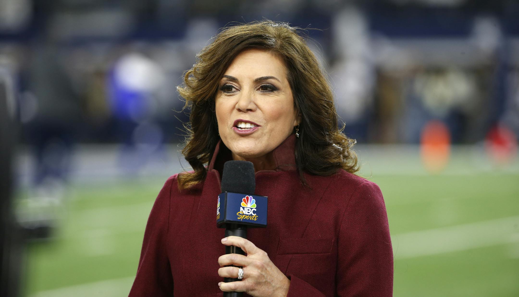 In this Nov. 19, 2017, file photo NBC sideline reporter Michele Tafoya reports before an NFL football game between the Philadelphia Eagles and Dallas Cowboys in Arlington, Texas. Tafoya will work her 250th NFL game as a sideline reported on Sunday night at AT&T Stadium when the Cowboys host the Giants. That's one of the favorite venues for Tafoya, who also has done games for ABC and ESPN and now is with NBC. (AP Photo/Ron Jenkins, File)