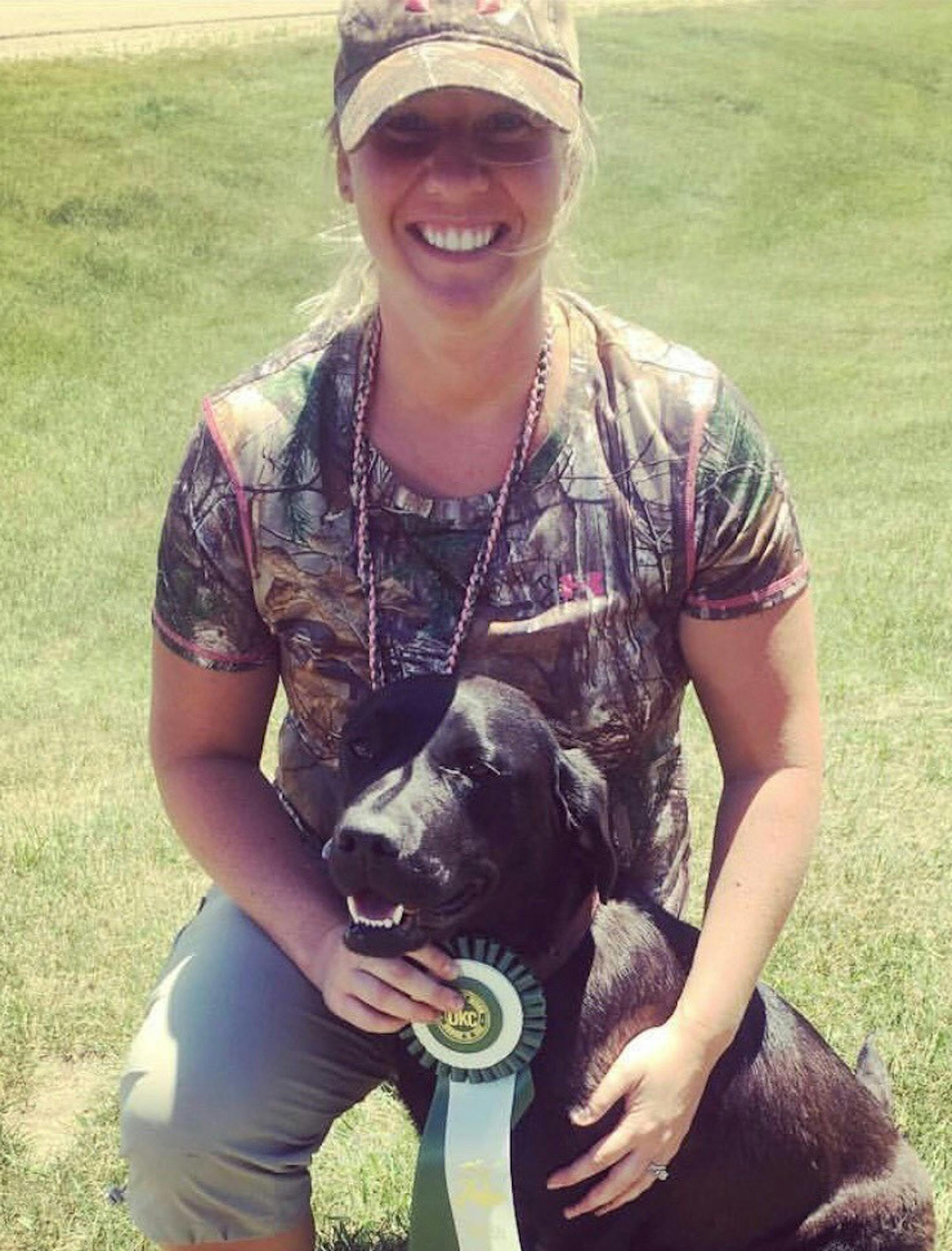 Janelle Negan and Brutus, a 3-year-old black Labrador retriever. Brutus will go through that training as a certified therapy dog this summer.