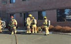 Firefighters work outside the Robbinsdale senior living home that was evacuated Saturday, Nov. 17, 2018.