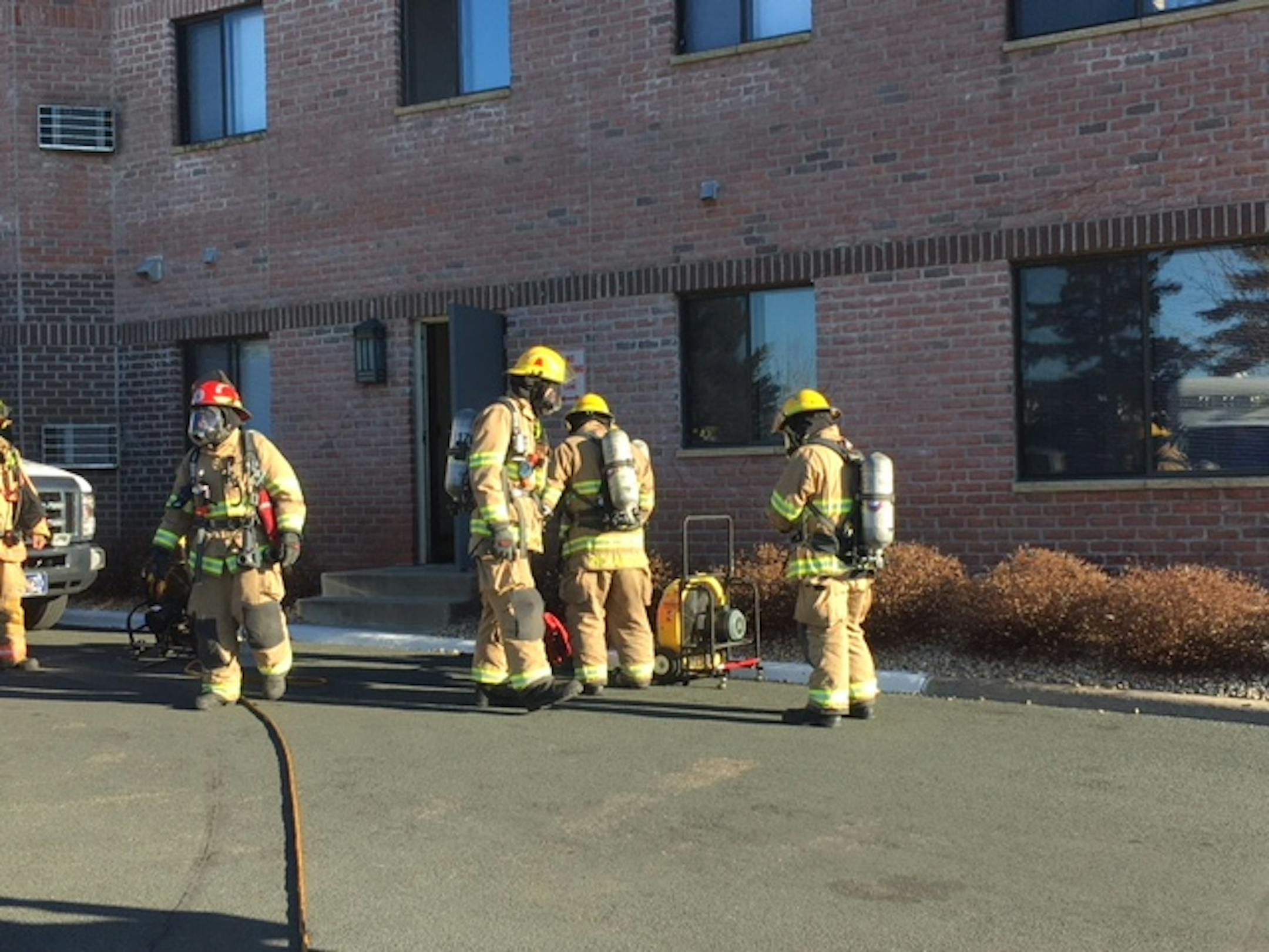 Firefighters work outside the Robbinsdale senior living home that was evacuated Saturday, Nov. 17, 2018.