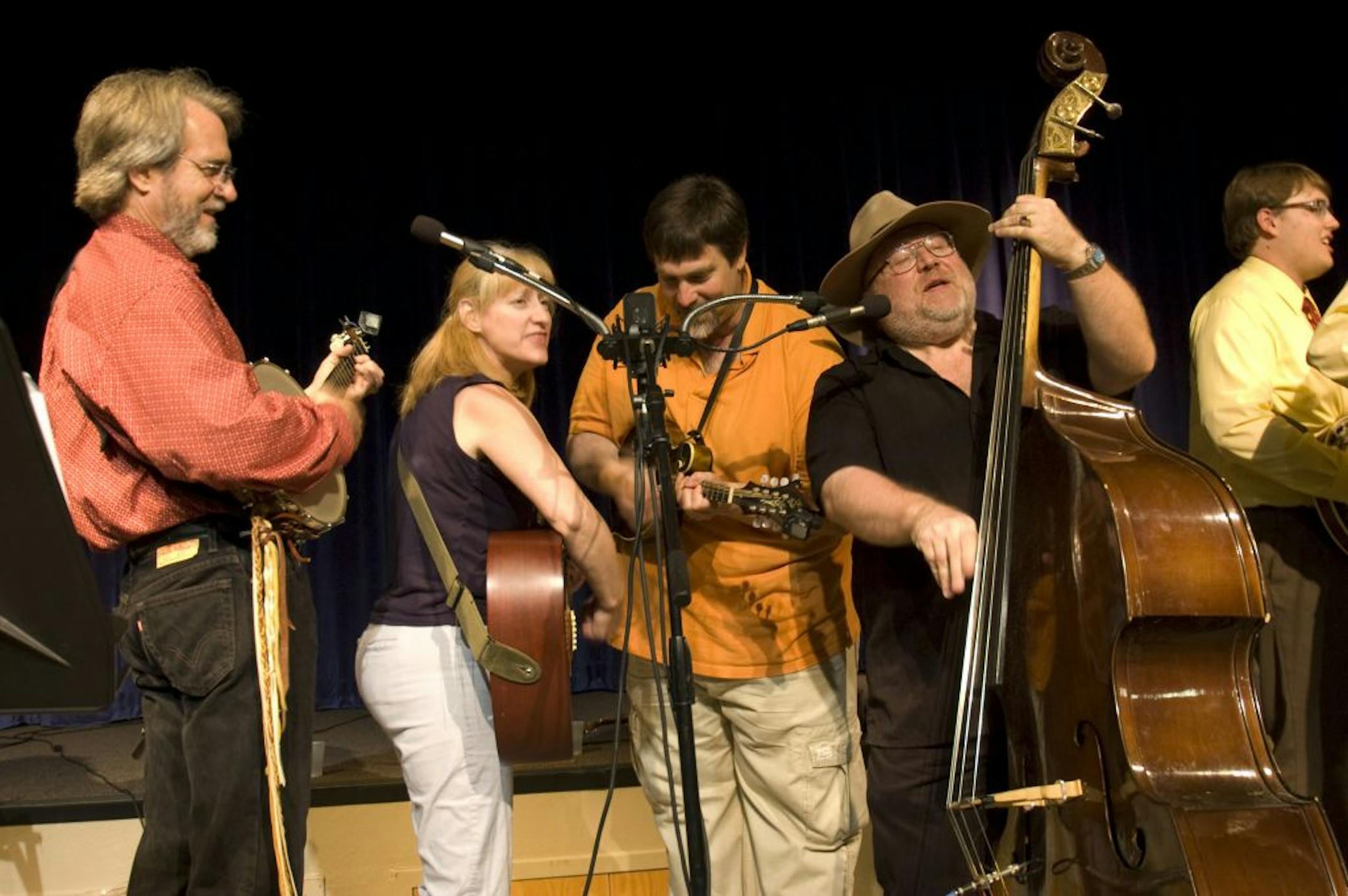 Members of Singleton Street (left to right): Craig Evans (banjo), Sherri Leyda (rhythm guitar), Chuck Leyda (guitar, mandolin), and Jimmy Newkirk