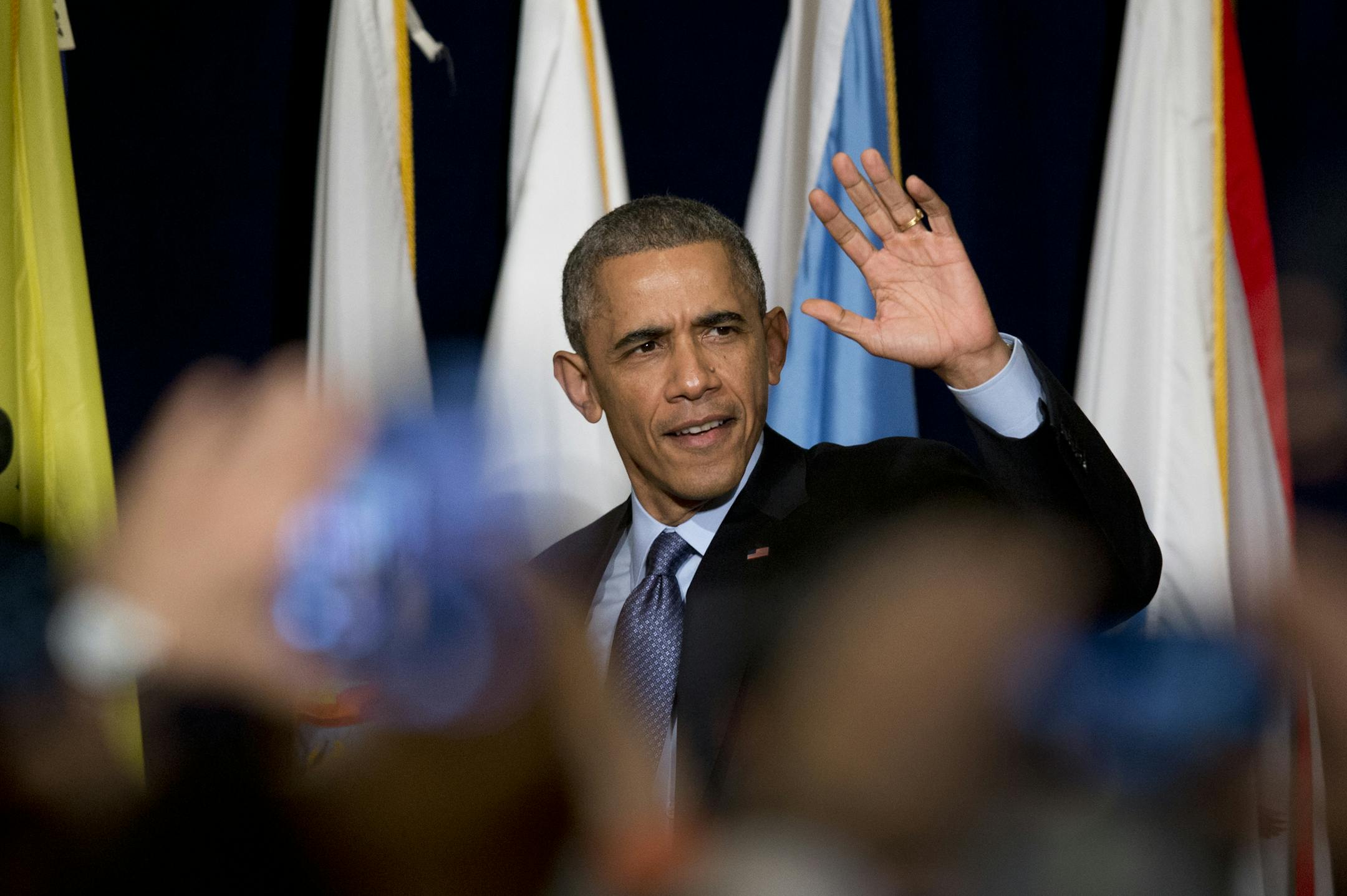 President Barack Obama arrives to speak during the 2014 White House Tribal Nations Conference at the Capital Hilton in Washington, Wednesday, Dec. 3, 2014, to announce an initiative aimed at improving conditions and opportunities for American Indian youth, more than a third of whom live in poverty. The president also spoke about a grand jury that cleared a white New York City police officer in the videotaped chokehold death of an unarmed black man who had been stopped on suspicion of selling loo