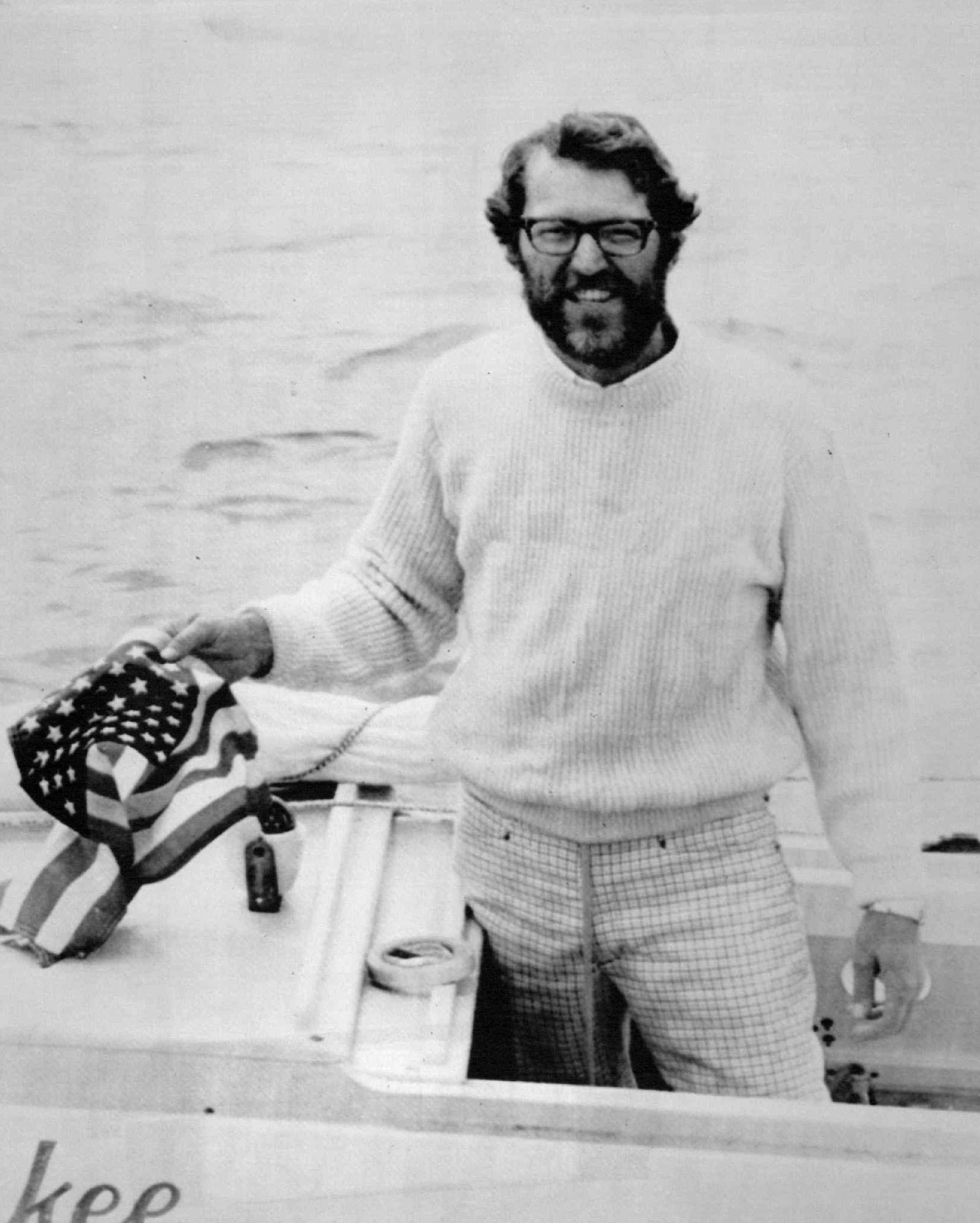 Lone American sailor Gerry Spiess, 39, of White Bear, Minnesota, stands aboard his 10-foot long boat "Yankee Girl" in Falmouth Harbor after completing his solo voyage across the Atlantic Ocean.