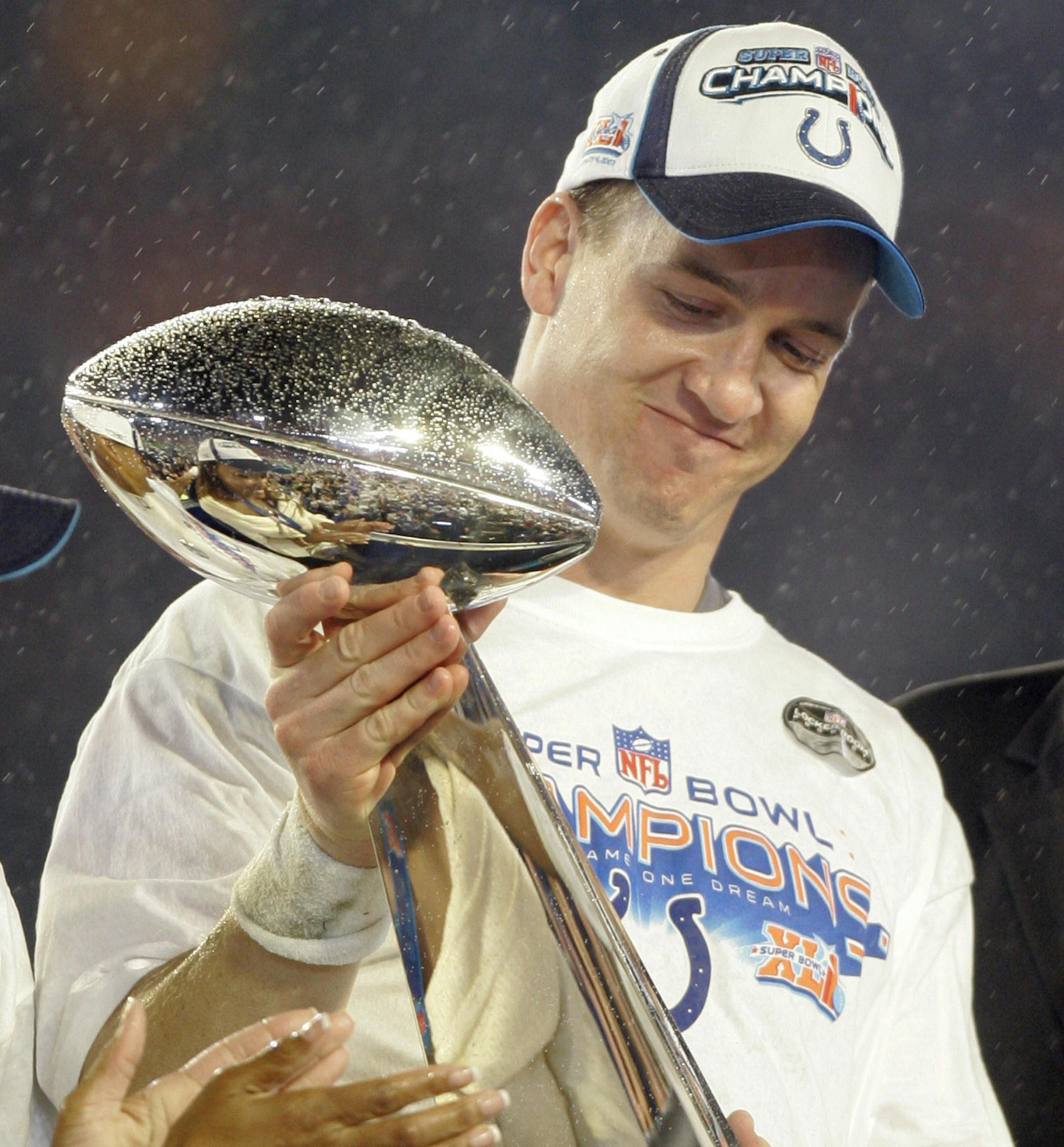 Indianapolis Colts' Peyton Manning (18) holds the Vince Lombardi Trophy after the Colts' 29-17 win over the Chicago Bears in the Super Bowl XLI football game at Dolphin Stadium in Miami on Sunday, Feb. 4, 2007. (AP Photo/Amy Sancetta) ORG XMIT: SB372