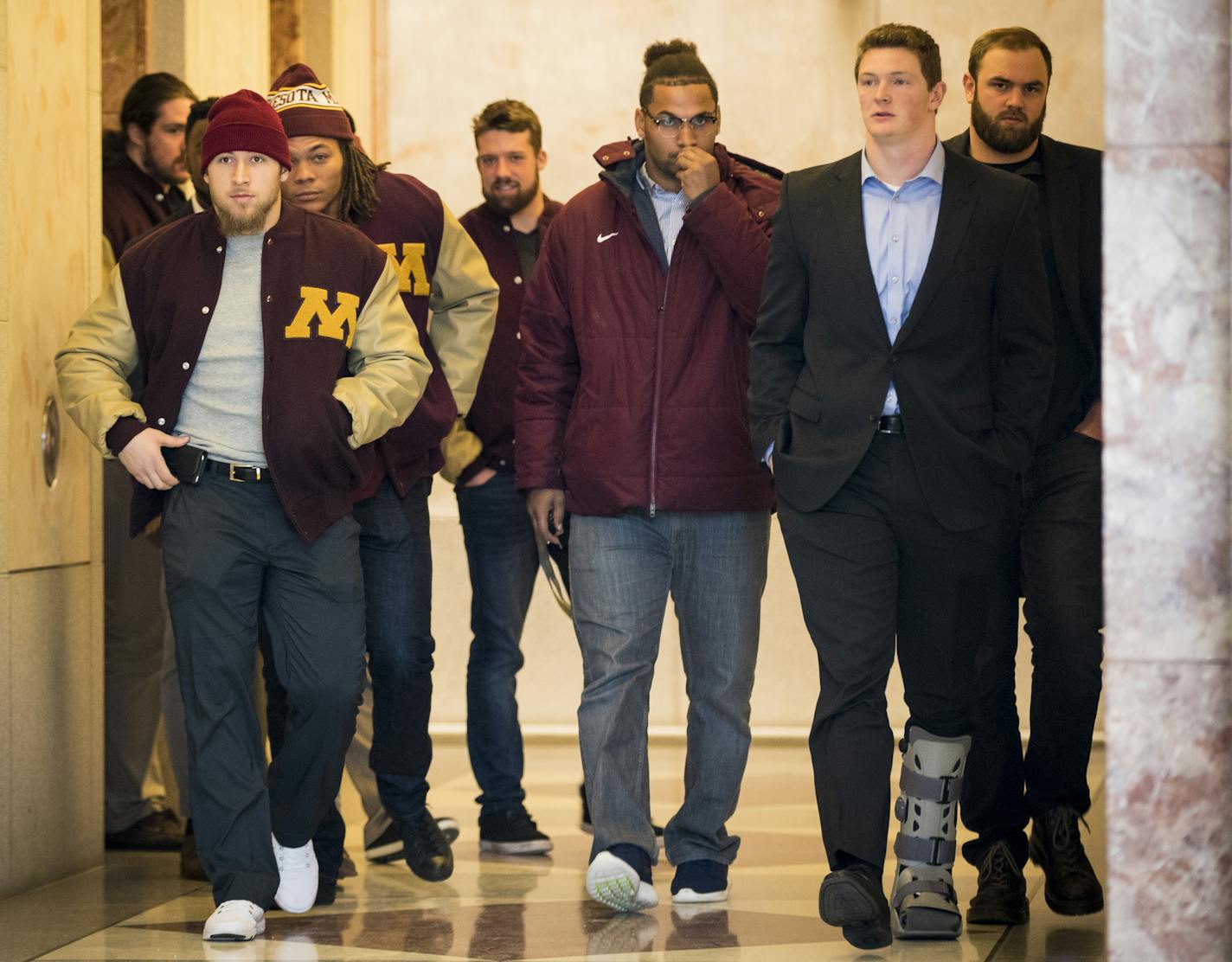 Gophers football players, none who have been suspended, walked out of a lawyer&#x2019;s office in Minneapolis early Friday.