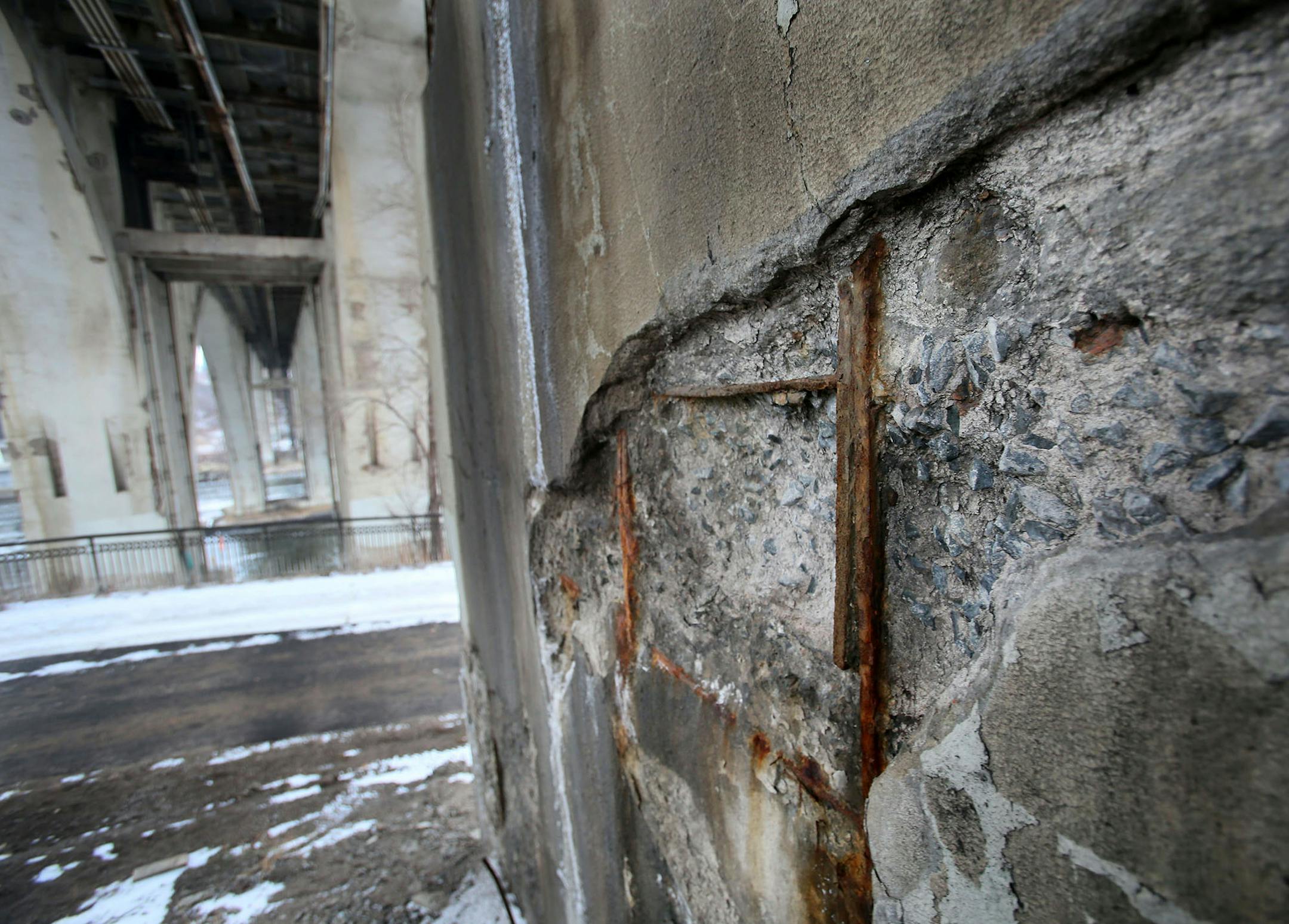 Exposed rebara on the Tenth Avenue Bridge Friday, Dec. 19, 2014.](DAVID JOLES/STARTRIBUNE)djoles@startribune.com This is a story about three bridges along the Mississippi River in Mpls. that need to be rehabilitated. The 3rd Avenue Bridge, the 10th Avenue Bridge and the Franklin Avenue Bridge ORG XMIT: MIN1412191724340026