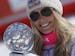 Lindsey Vonn, of the United States, holds the alpine ski, women's World Cup downhill's discipline trophy, at the World Cup finals as she celebrates in