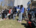 People mourn the loss of shooting victim Kevin Beasley in Minneapolis on Sunday, April 19, 2020. Beasley was the man shot to death at a house party in
