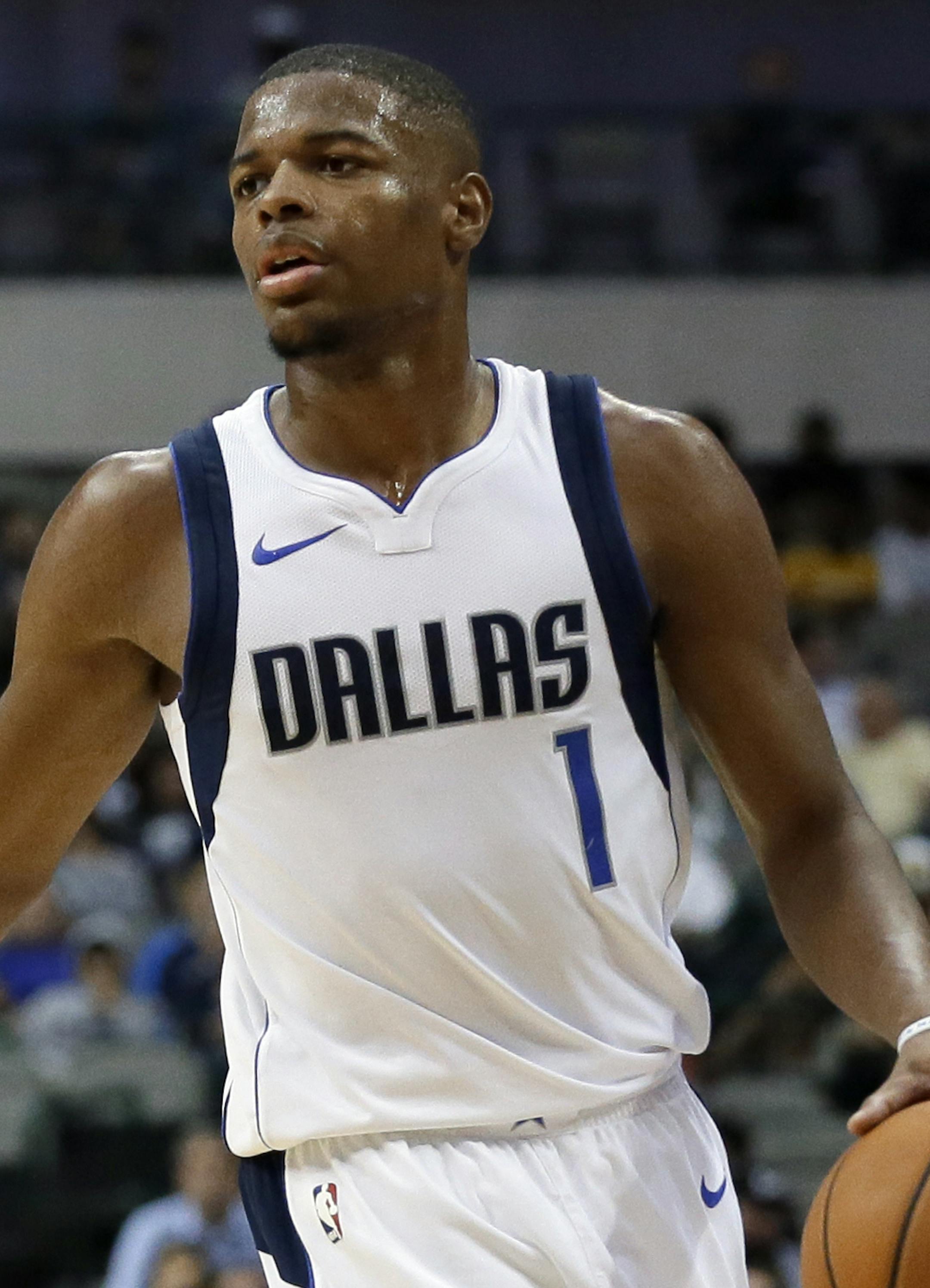 Dallas Mavericks guard Dennis Smith Jr. (1) handles the ball in the second half of a preseason NBA basketball game against the Orlando Magic on Monday, Oct. 9, 2017, in Dallas. (AP Photo/Tony Gutierrez) ORG XMIT: OTKTG102