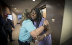 Valerie Castile, mother of Philando Castile was hugged by a supporter after the Board of Peace Officer Standards and Training (POST), voted against a 