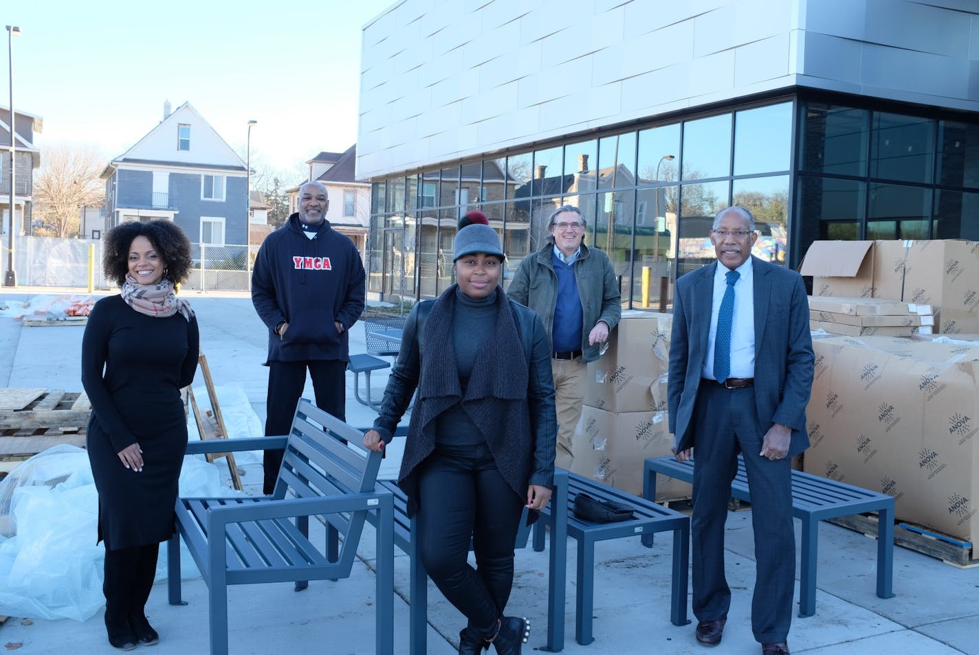 Leaders behind a development along W. Broadway in north Minneapolis gathered at the Capri Theater: (left to right) architect Damaris Hollingsworth, developer Tim Baylor; Juxtaposition Arts Managing Director Gabrielle Grier; Capri Theater Director James Scott and Warren McLean, president of the Northside Economic Opportunity Network.