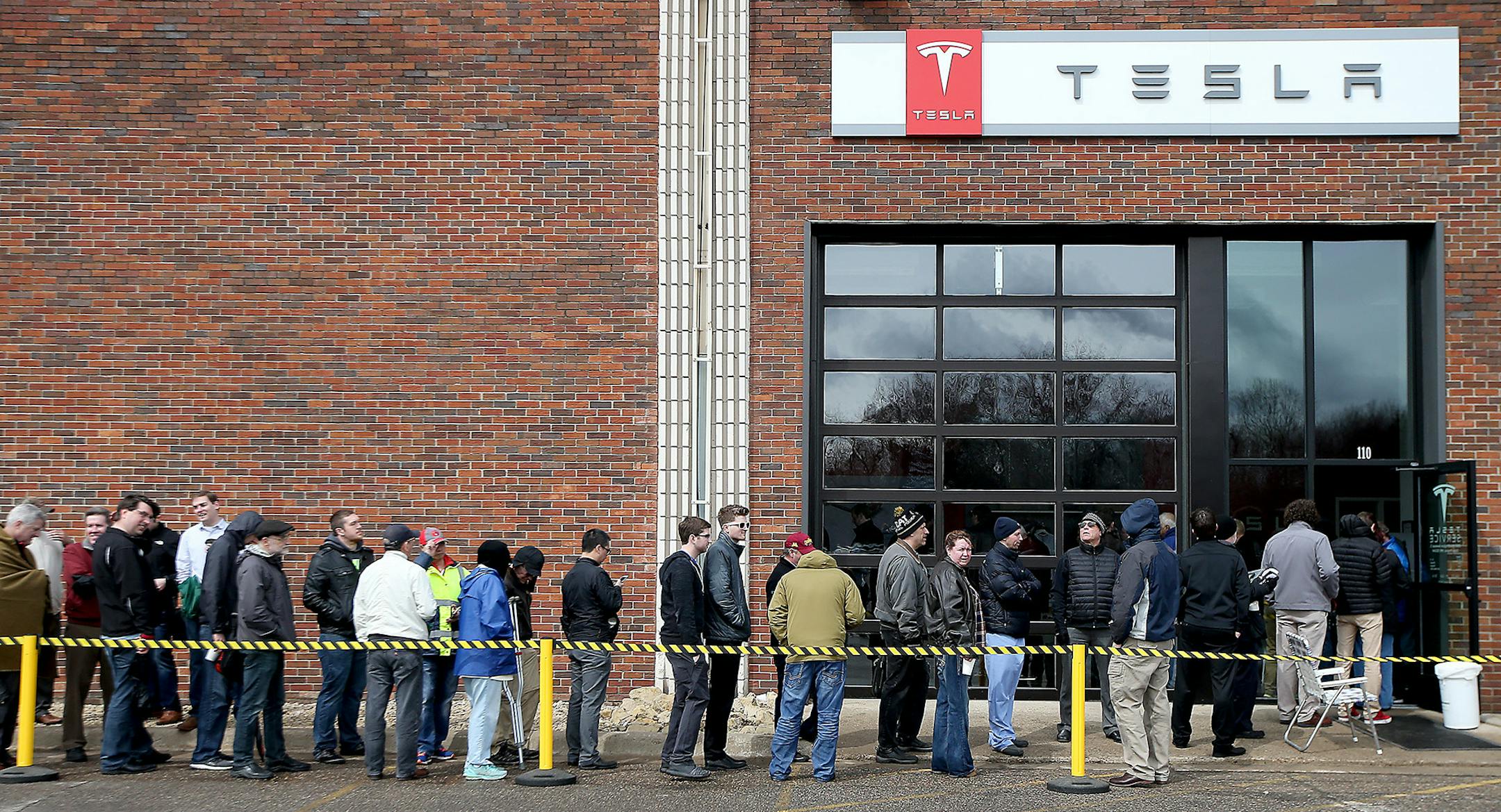 Car enthusiasts lined up outside Tesla in Eden Prairie, MN, Thursday March 31, 2016. They did this to get on a waiting list for the new Model 3 electric car. With a starting price of $35,000 before government incentives, the Model 3 is less than half the cost of Tesla's previous models. The car will be revealed Thursday night at its Los Angeles design studio. ] (ELIZABETH FLORES/STAR TRIBUNE) ELIZABETH FLORES &#x2022; eflores@startribune.com