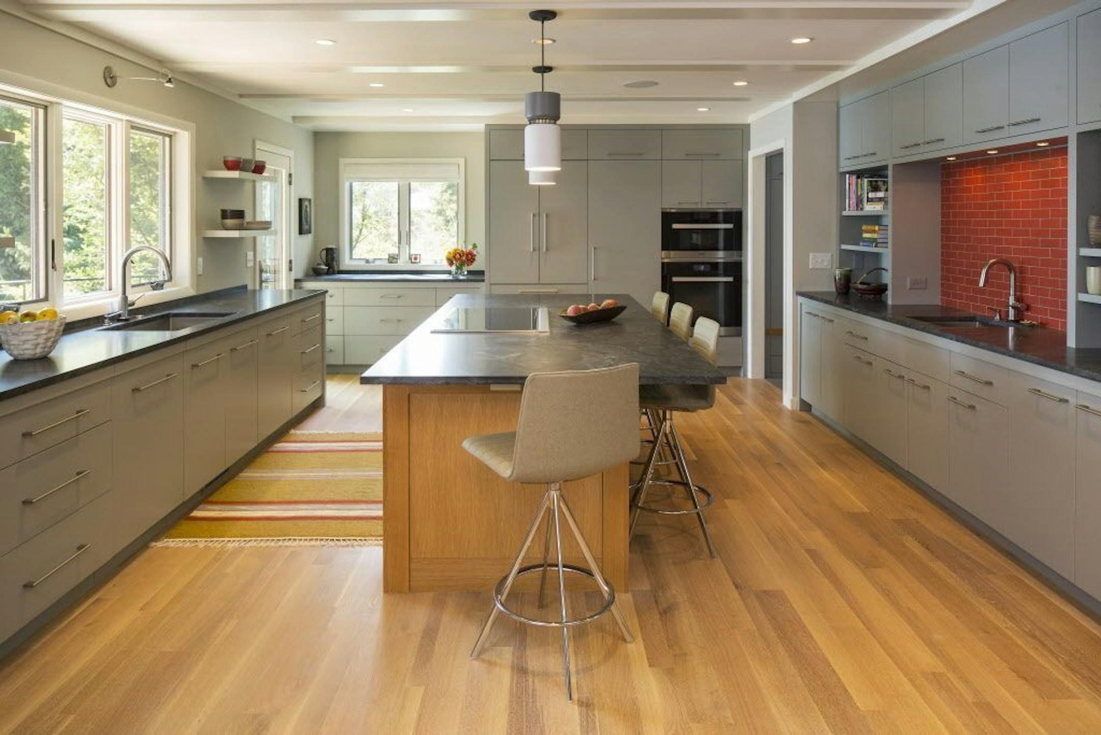 A midcentury rambler's renovation updated and doubled the size of the kitchen; by Mark Larson, Rehkamp Larson Architects.