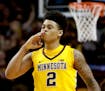 The University of Minnesota's Nate Mason (2) signaled a three and sealed it with a kiss during the Gopher's 81-71 win over Penn State Saturday, Feb. 2