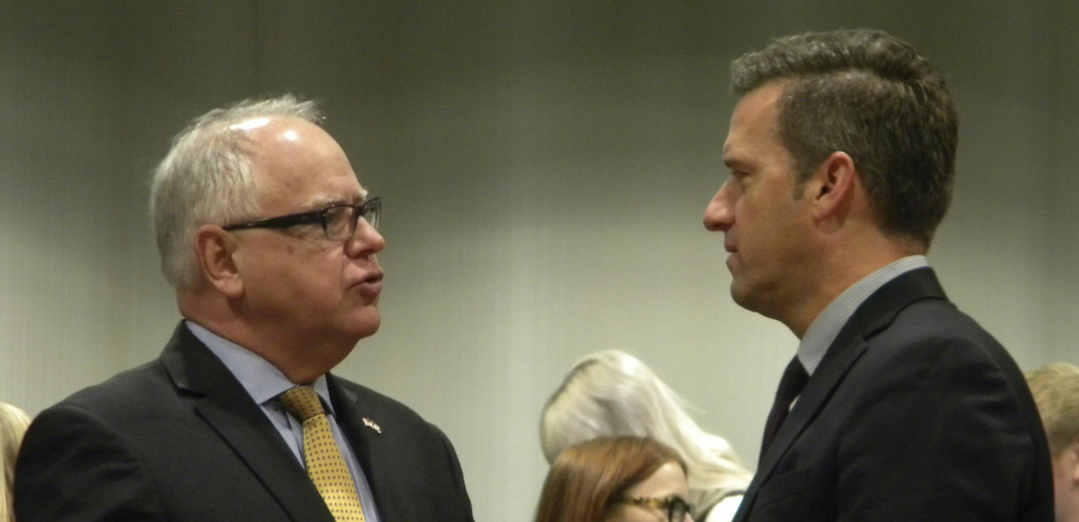 Minnesota Gov. Tim Walz, left, talks with Minnesota House Minority Leader Kurt Daudt just before a briefing for reporters on Monday, Jan. 14, 2019, in St. Paul, Minnesota.(AP Photo/Steve Karnowski)