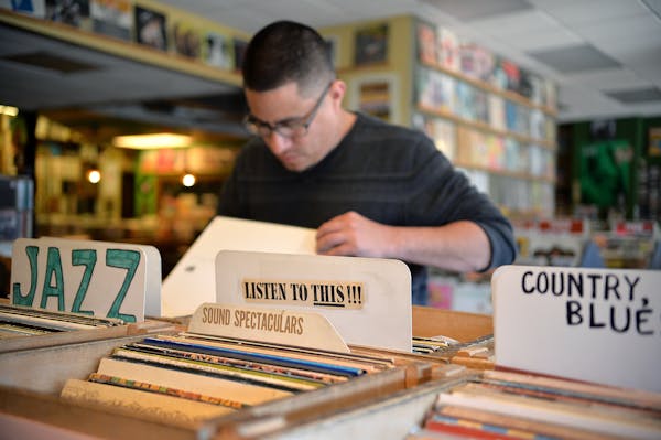 KFAI DJ Miguel Vargas browses the recently added vinyls at Hymie's Vintage Records in south Minneapolis.