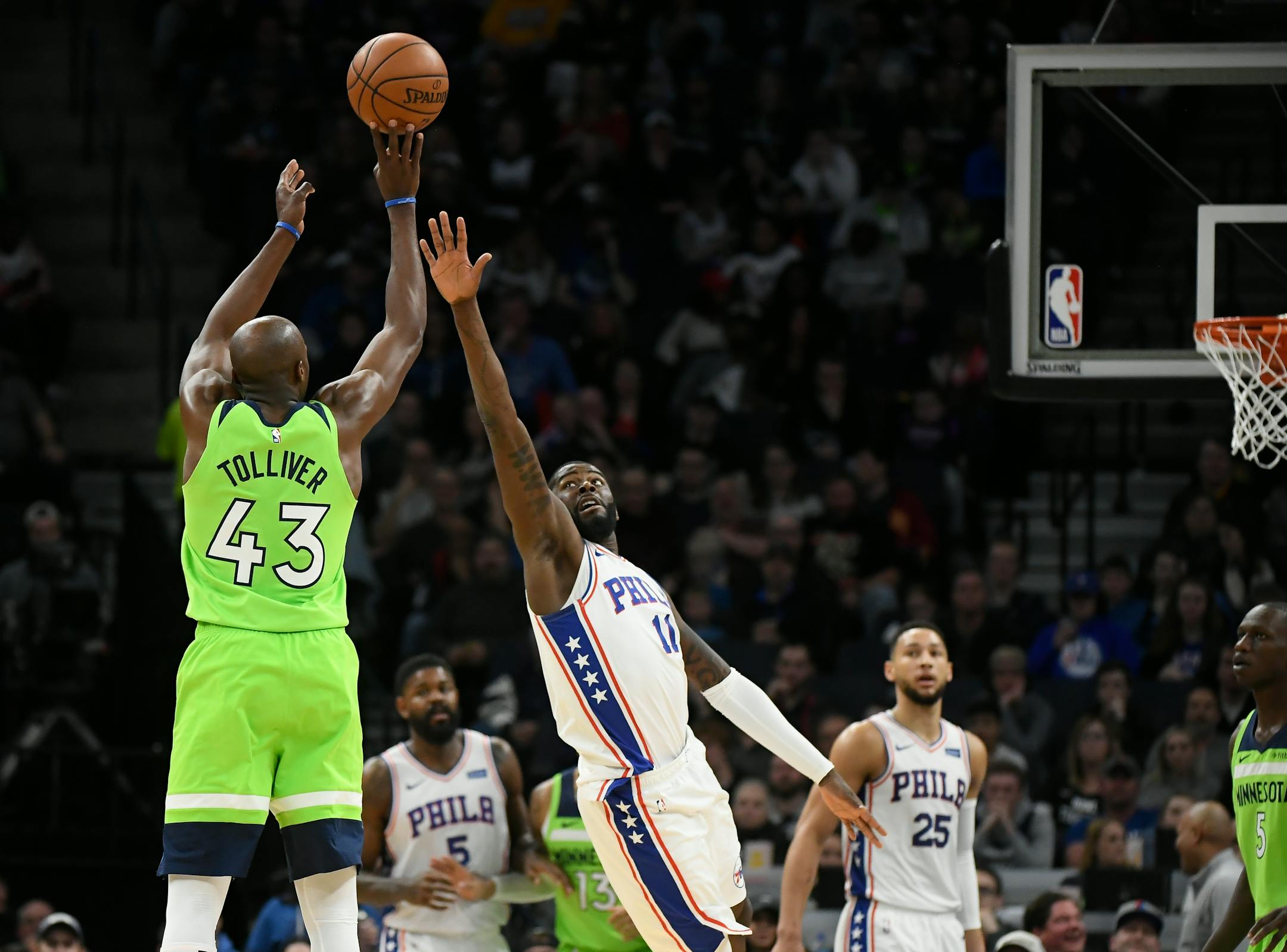 Minnesota Timberwolves forward Anthony Tolliver hit a 3-pointer over Philadelphia 76ers forward James Ennis III