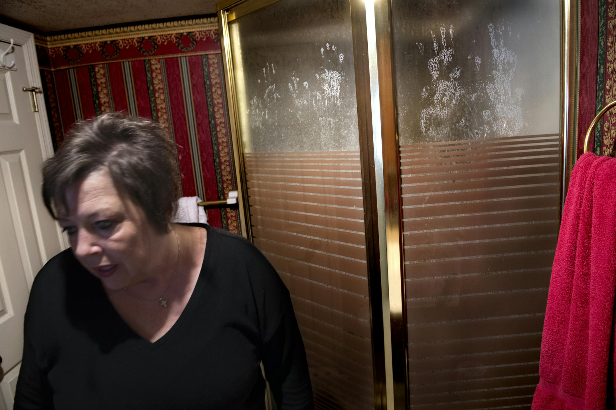 Tina can't bring herself to clean Kimi's handprints off the shower after her granddaughter's death. Must credit: Washington Post photo by Linda Davidson