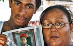 Family of Mark Eric Henderson Jr., 19, of St. Paul, who was fatally shot by police in an incident in Woodbury yesterday. Left, brother Fred Henderson,