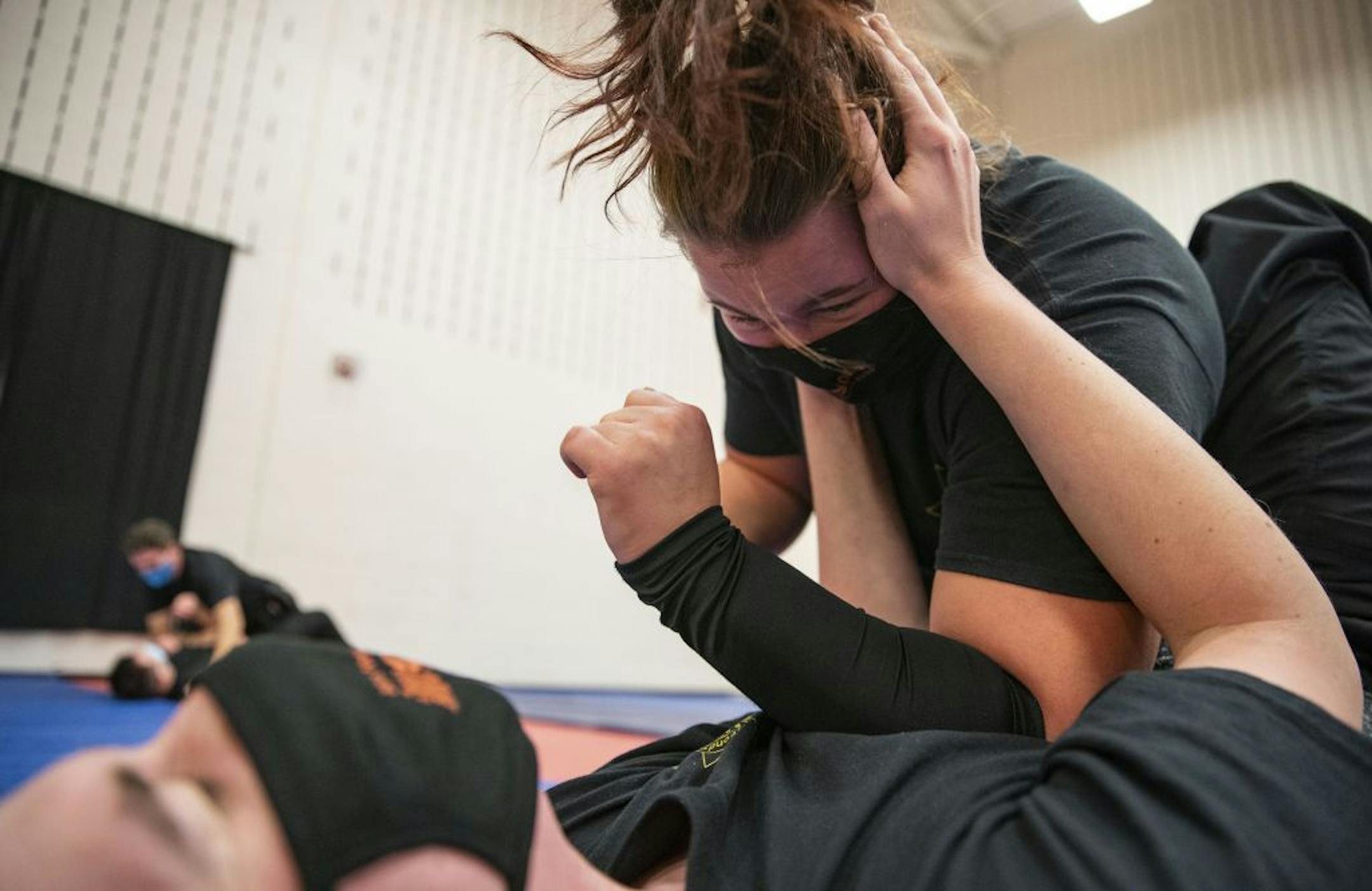 (Top) Katherine Johnson practiced proper ground fighting technique with Collin O'Toole during defensive tactics class at Fond Du Lac Tribal and Community College in Cloquet, Minn. on Tuesday November 17, 2020.