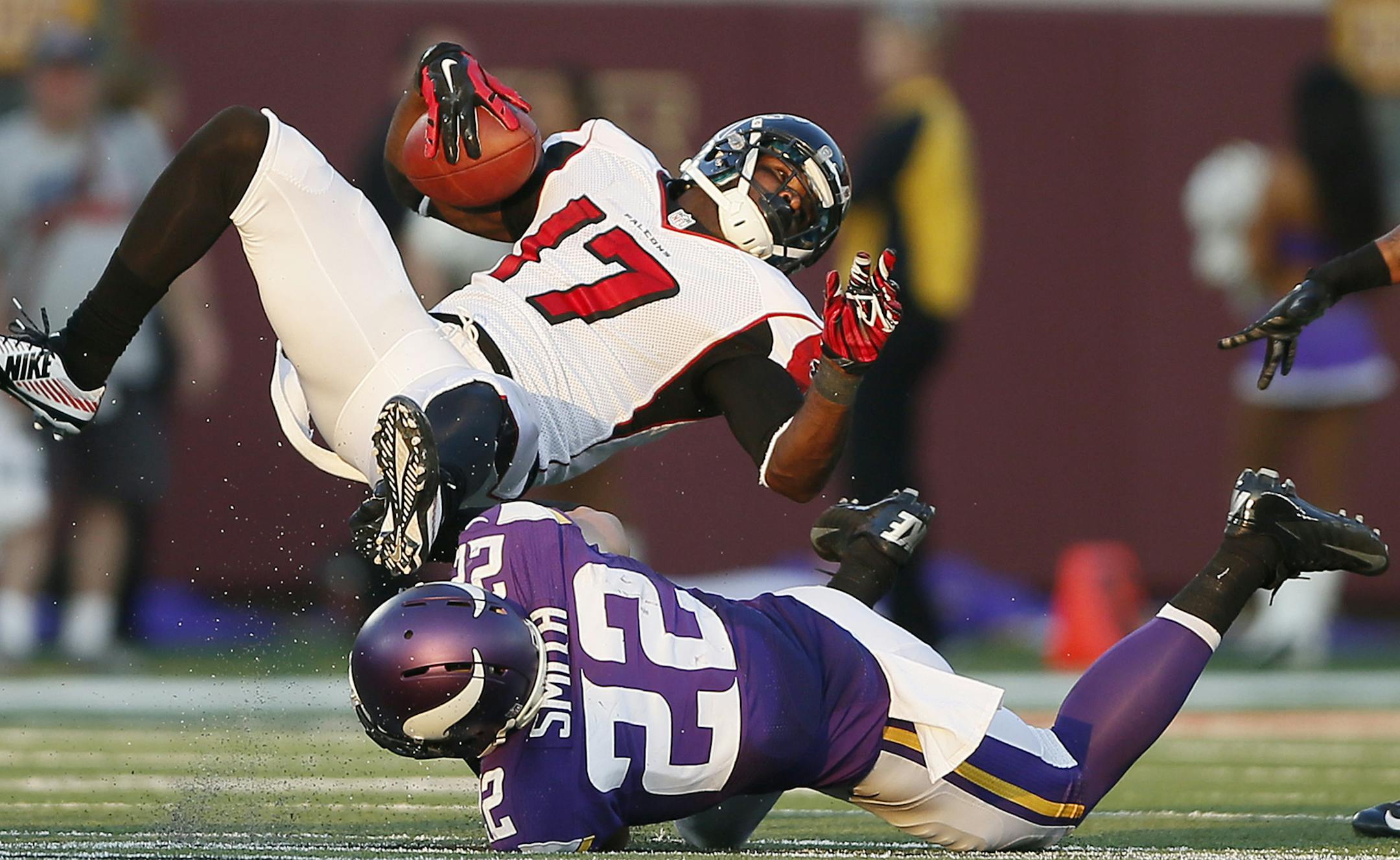 Minnesota Vikings free safety Harrison Smith (22) upended Atlanta Falcons wide receiver Devin Hester (17) in the second half.The Minnesota Vikings played the Atlanta Falcons at TCF Bank Stadium Sunday September 28 , 2014 in Minneapolis ,MN. ] Jerry Holt Jerry.holt@startribune.com