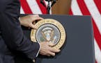 President Barack Obama presidential emblem was placed on the podium before he spoke to a crowd at the Union Depot, Wednesday, February 26, 2014 in St.