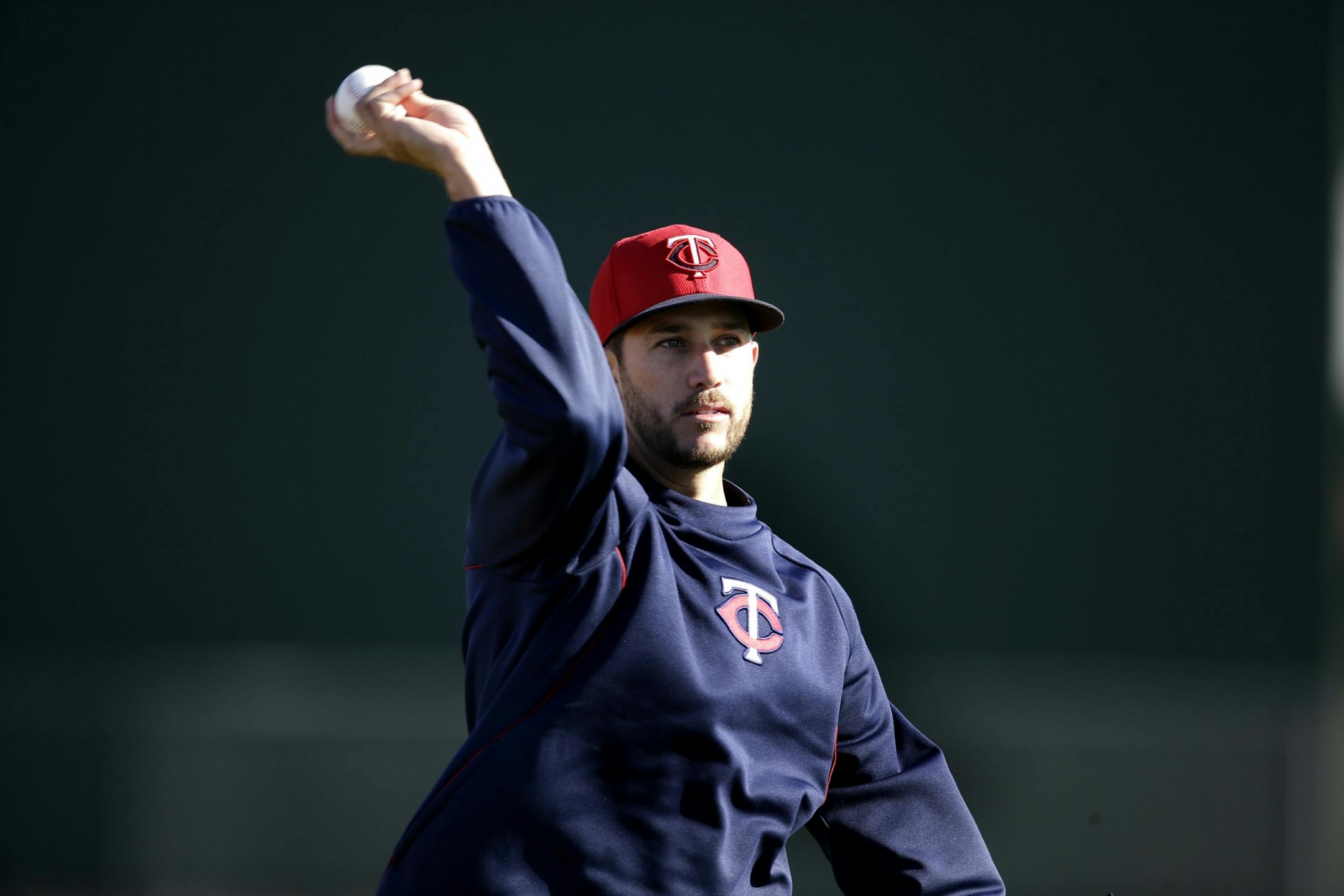 Twins infielder Trevor Plouffe warmed up during practice Sunday.