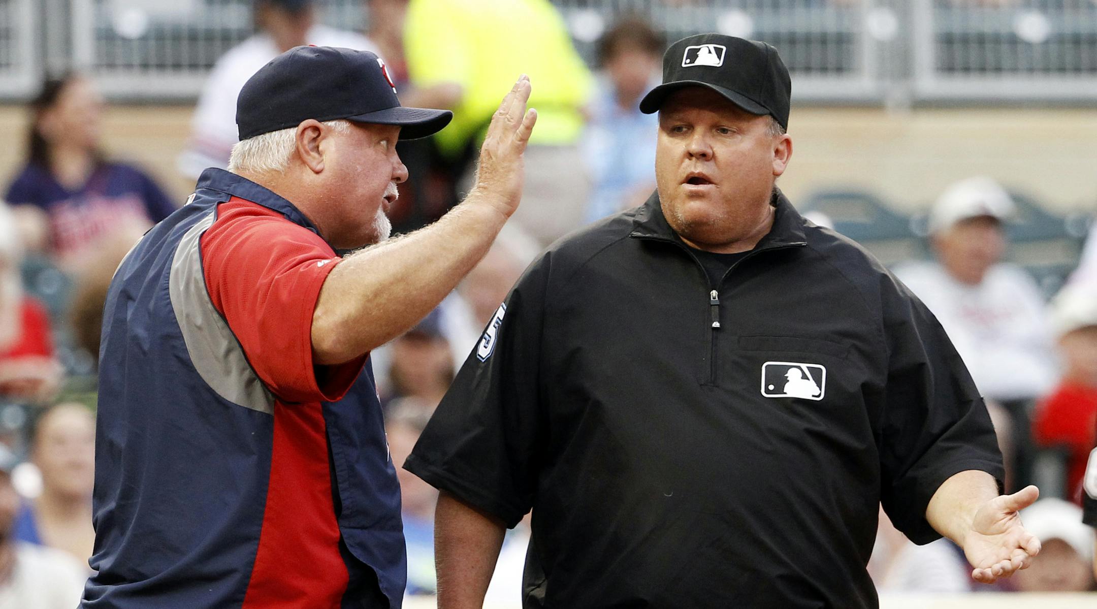 Minnesota Twins manager Ron Gardenhire, left, argues with third base umpire Fieldin Culbreth after being ejected during the first inning of a baseball game against the Kansas City Royals in Minneapolis, Monday, Aug. 18, 2014. (AP Photo/Ann Heisenfelt)