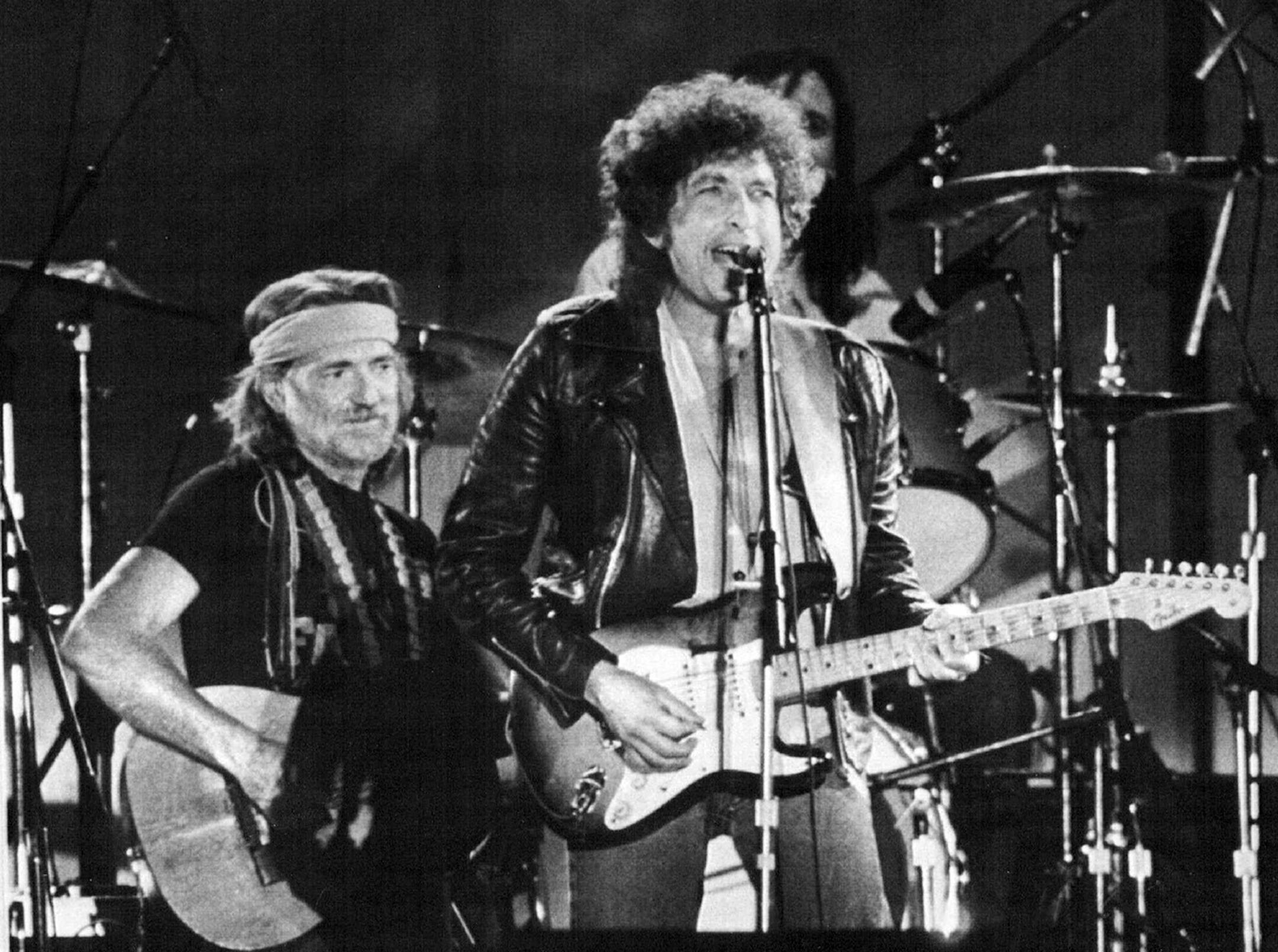 Willie 'N' Bobby -- Country singer Willie Nelson joined folk and rock singer Bob Dylan, right, on stage before more than 78,000 people attending the FarmAid benefit concert in September 1985 at the University of Illinois football stadium. Nelson was the driving force behind the 14-hour concert, which included more than 50 stars of country, rock, blues and bluegrass.