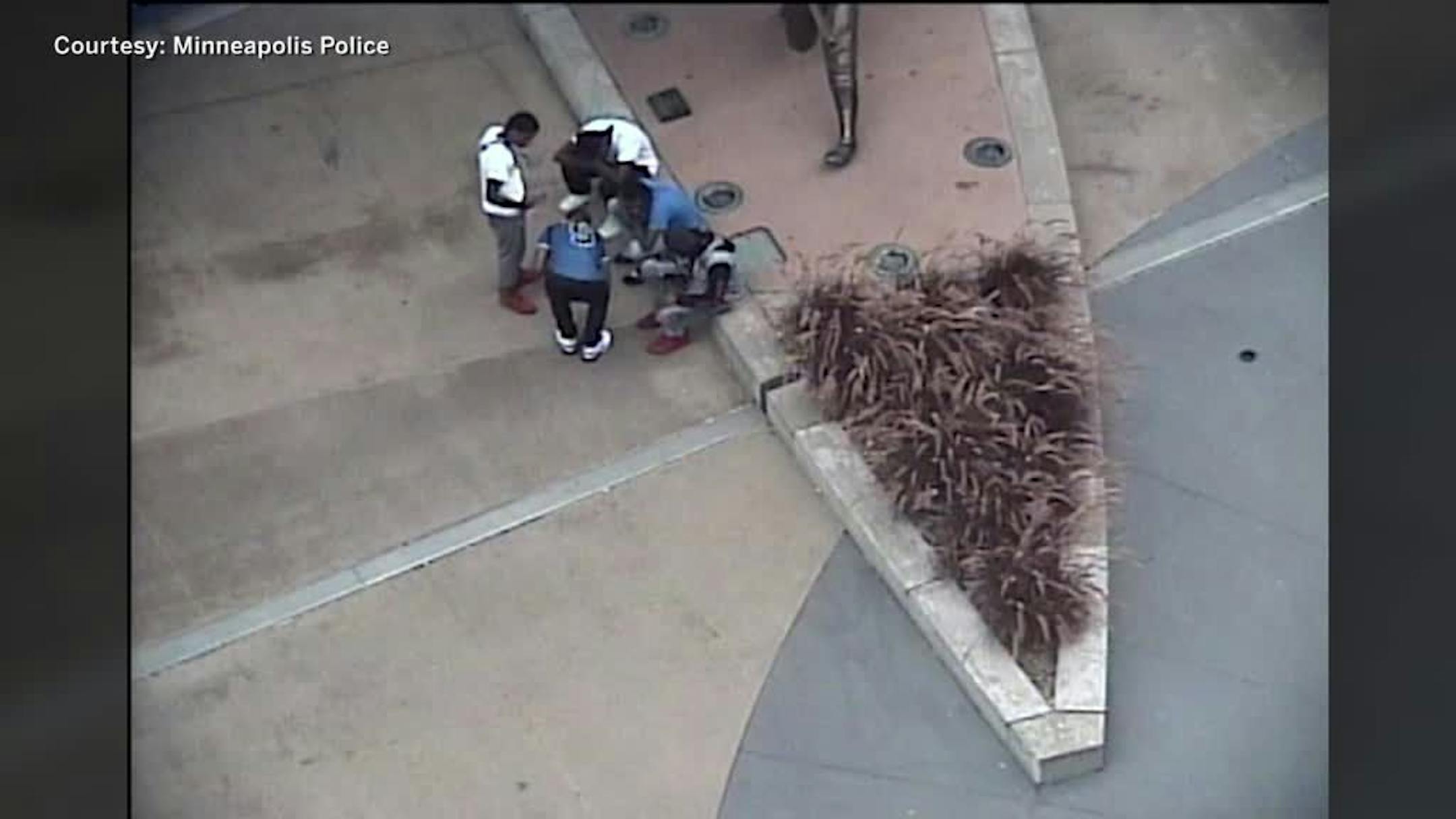 A still from surveillance video showed an Aug. 3, 2019, attack near Target Field in downtown Minneapolis in which the suspects kicked and punched the victim, ran over him with a bicycle and hit him with planters.
