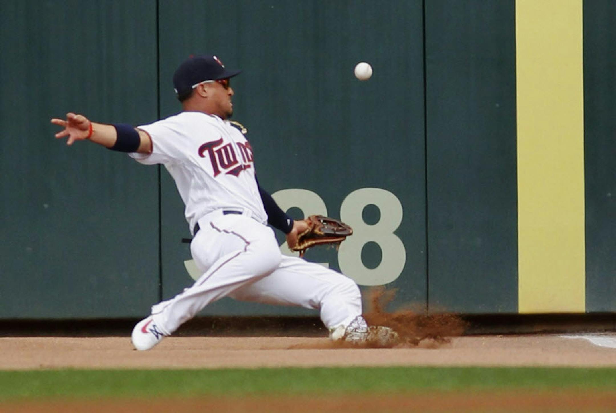 Minnesota Twins right fielder Oswaldo Arcia misses at hit by Kansas City Royals Lorenzo Cain in the first inning