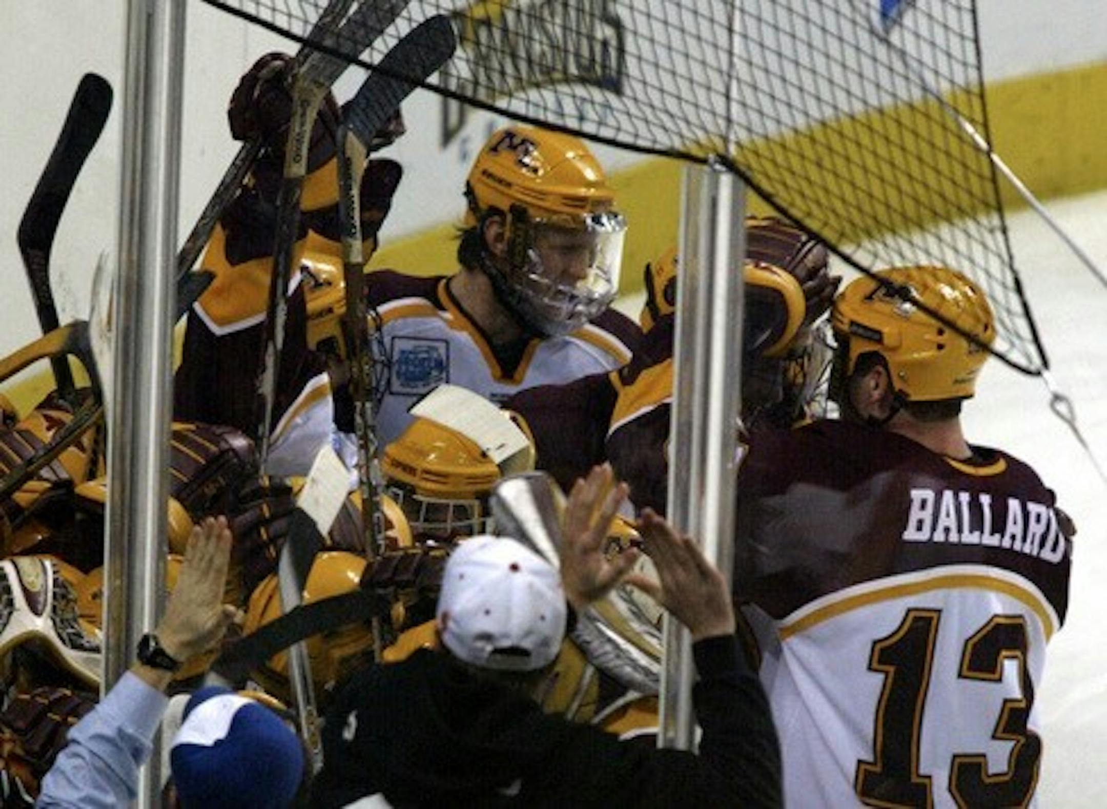 Buffalo, New York, Thursday, 4/10/2003.  Minnesota vs. Michigan in Frozen Four Semi-Finals.  The Minnesota Gophers swamped Thomas Vanek after he scored the game winning goal in overtime to advance to the Frozen Four Championship.