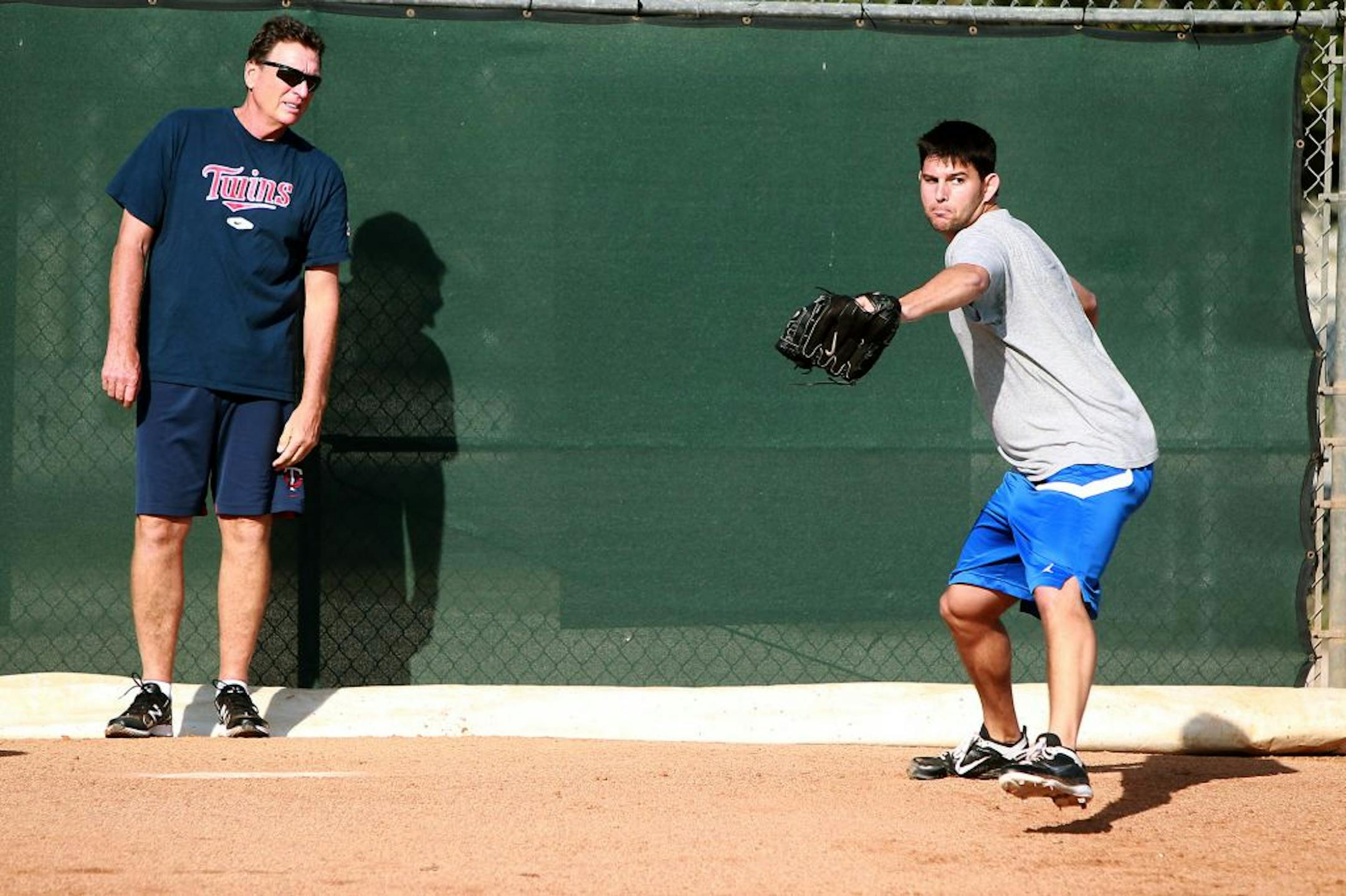 Righthander Carlos Gutierrez threw in front of minor league coach Eric Rasmussen on a practice field near Hammond Stadium last month. Gutierrez, 25, is hoping to demonstrate he has what it takes to earn a big-league job in 2012.