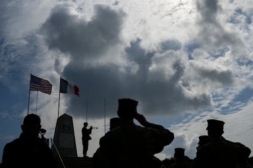 Members of the U.S. joint military service academy choir take part in a ceremony at Utah Beach near Sainte-Marie-du-Mont, Normandy, France, on June 5. This year marked 80 years since the D-Day landings that helped lead to Adolf Hitler's defeat.