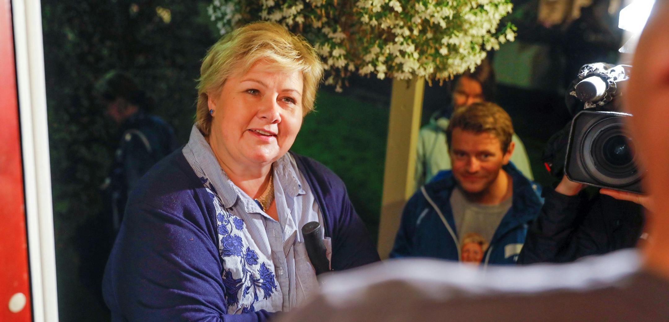 Norway's Prime Minister and leader of the Conservative Party, Erna Solberg, makes house visits in Fana, Bergen, Norway, Sept. 10, 2017. Norway's upcoming election has sparked a wide-ranging debate about national values, leaving voters wrestling with how close the Nordic country should be to the European Union and what its responsibilities are toward migrants and asylum-seekers. (Tore Meek / NTB scanpix via AP) ORG XMIT: LON832