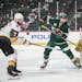 Minnesota Wild left wing Marcus Foligno (17) and Vegas Golden Knights defenseman Alex Pietrangelo (7) competed for the puck in the first period. ]
