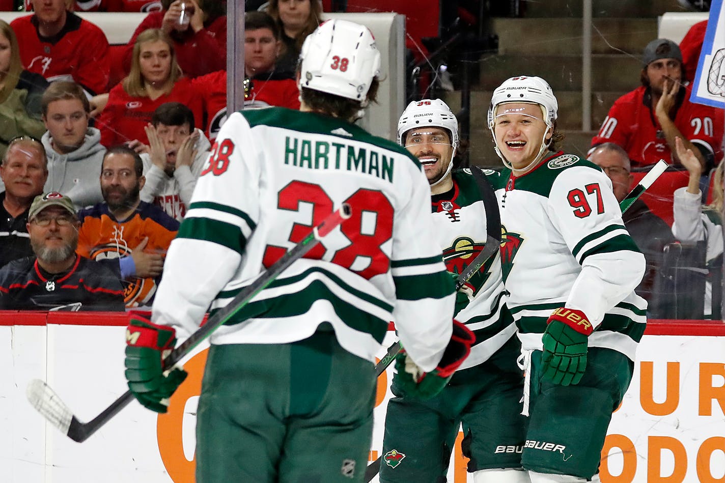 The Wild's Kirill Kaprizov celebrates his goal against the Hurricanes with Mats Zuccarello and Ryan Hartman during the third period Saturday in Raleigh, N.C.