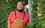Yia Vang stands in front of the new location for his forthcoming brick-and-mortar restaurant, Vinai, which celebrates food from his family's Hmong her