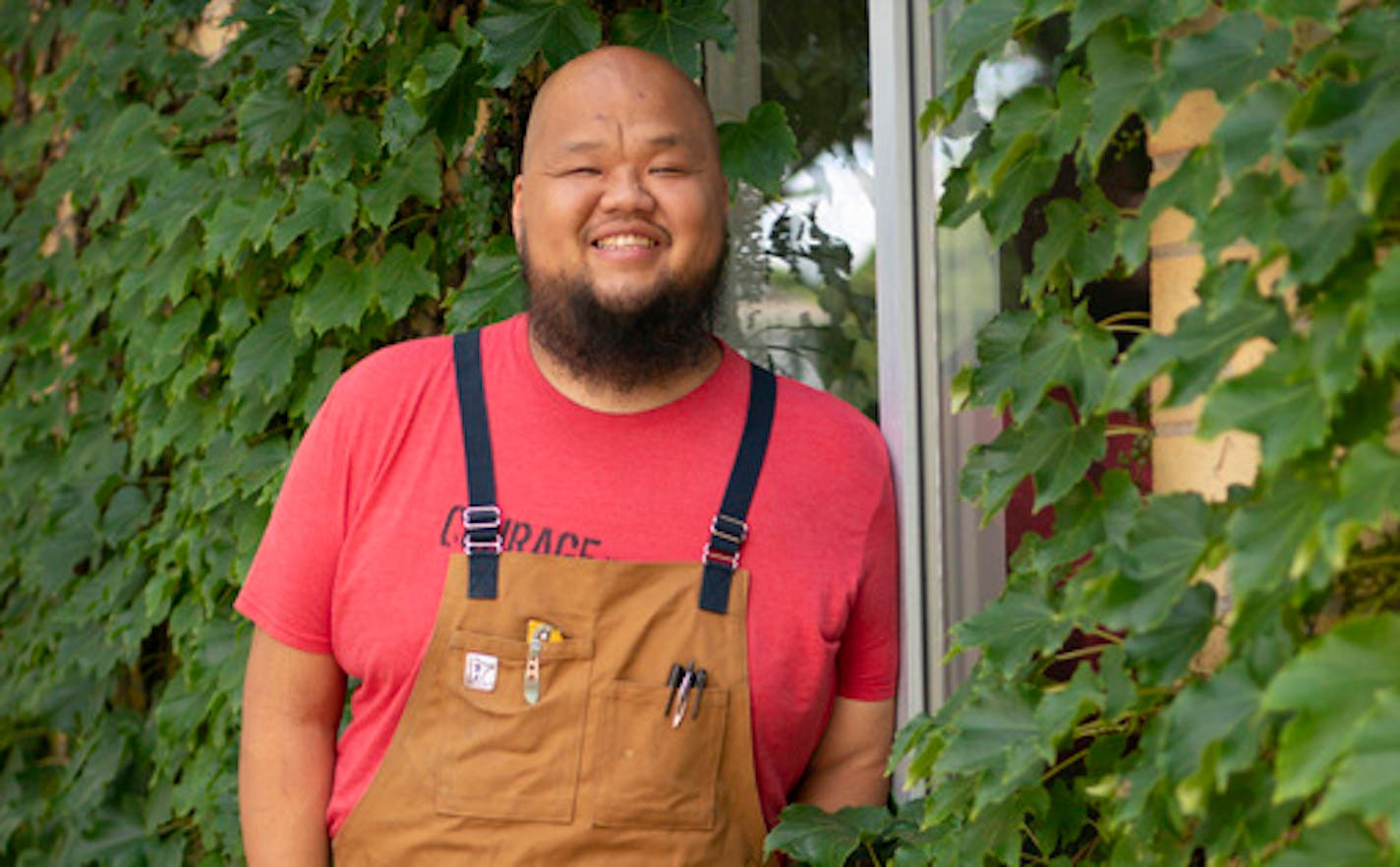 Yia Vang stands in front of the new location for his forthcoming brick-and-mortar restaurant, Vinai, which celebrates food from his family's Hmong heritage.