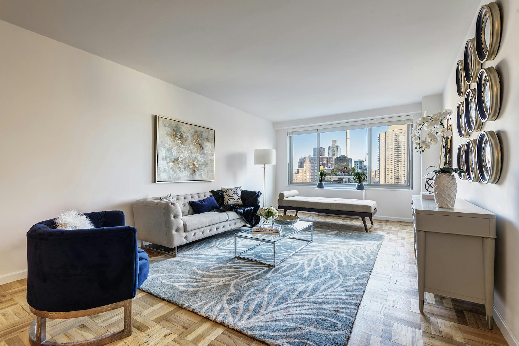 A chaise serves as an affordable alternative to a sofa or chairs in this living space.