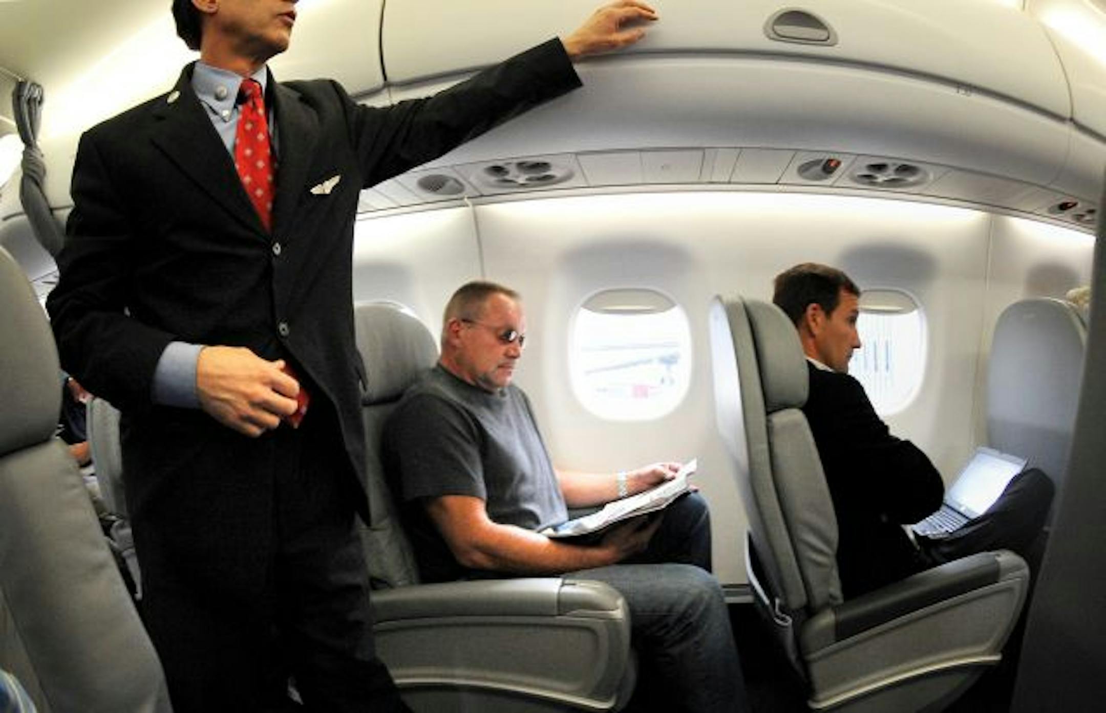 Flight attendants' job of ensuring safe stowage of carry-ons has gotten more difficult in the wake of fees for checked bags, creating shortage of space in bins and shortness of temper in the aisles.