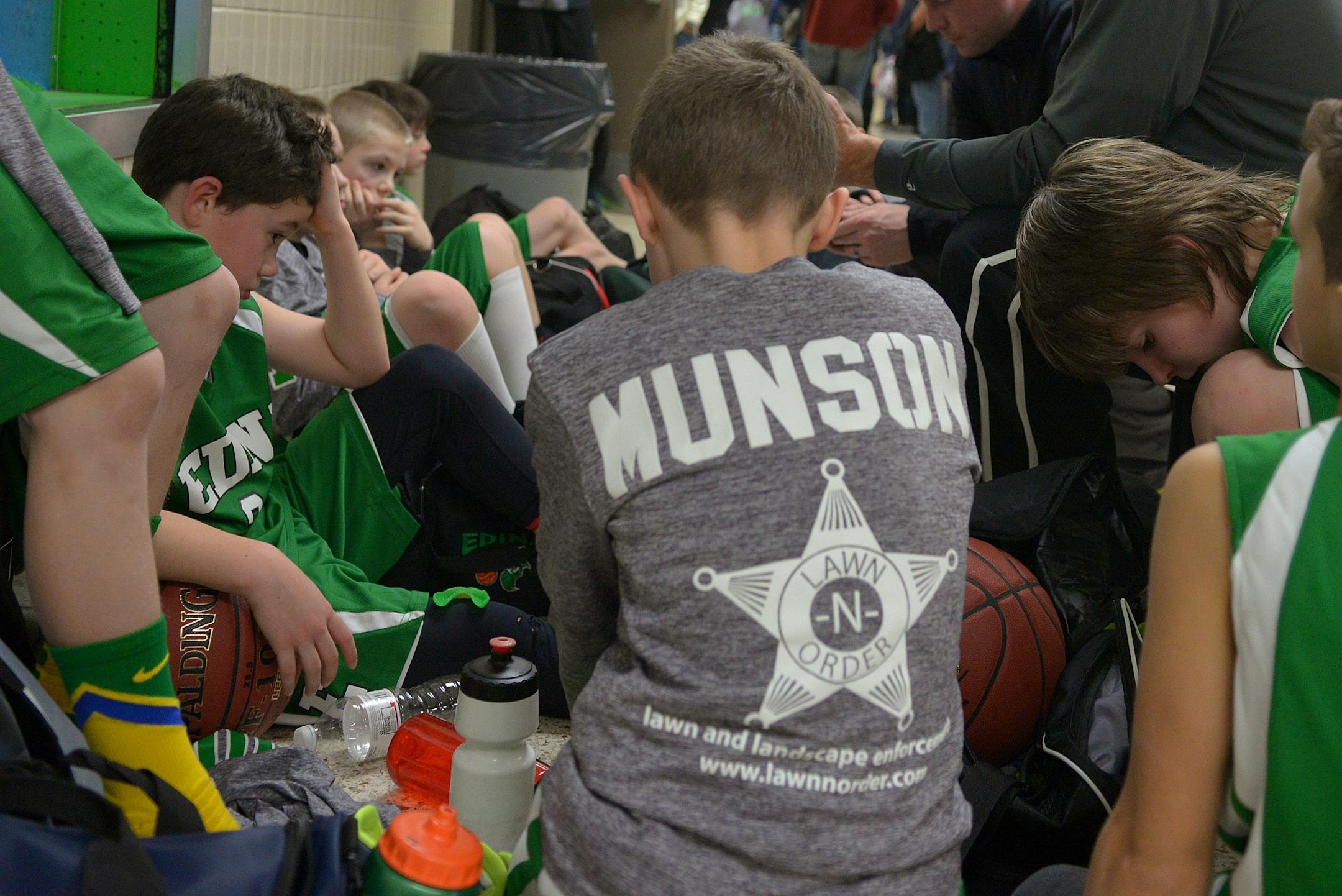 Edina's boys' 4A traveling basketball head coach, Paul Schmidt, talks to his players following a recent tournament loss to Chanhassen.