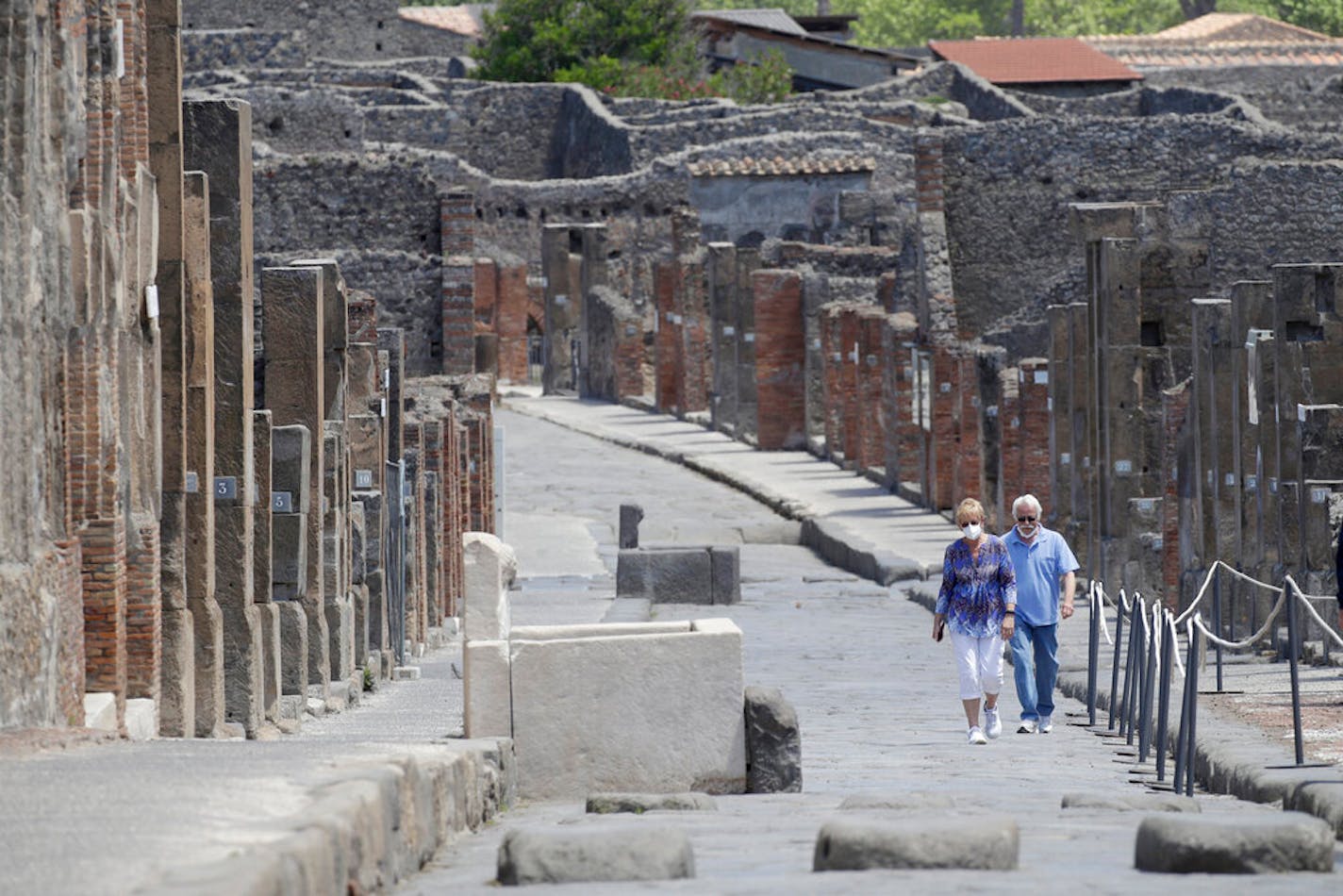 Colleen and Marvin Hewson, from the United States, visit the archaeological site of Pompeii, near Naples, southern Italy, Tuesday, May 26, 2020.