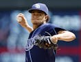 Tampa Bay Rays pitcher Chris Archer throws against the Minnesota Twins in the first inning of a baseball game, Sunday, May 17, 2015, in Minneapolis.