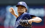 Tampa Bay Rays pitcher Chris Archer throws against the Minnesota Twins in the first inning of a baseball game, Sunday, May 17, 2015, in Minneapolis.