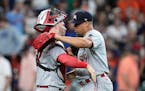 Minnesota Twins catcher Ryan Jeffers, left, and relief pitcher Jhoan Duran (59) celebrate after a baseball game against the Houston Astros Monday, May