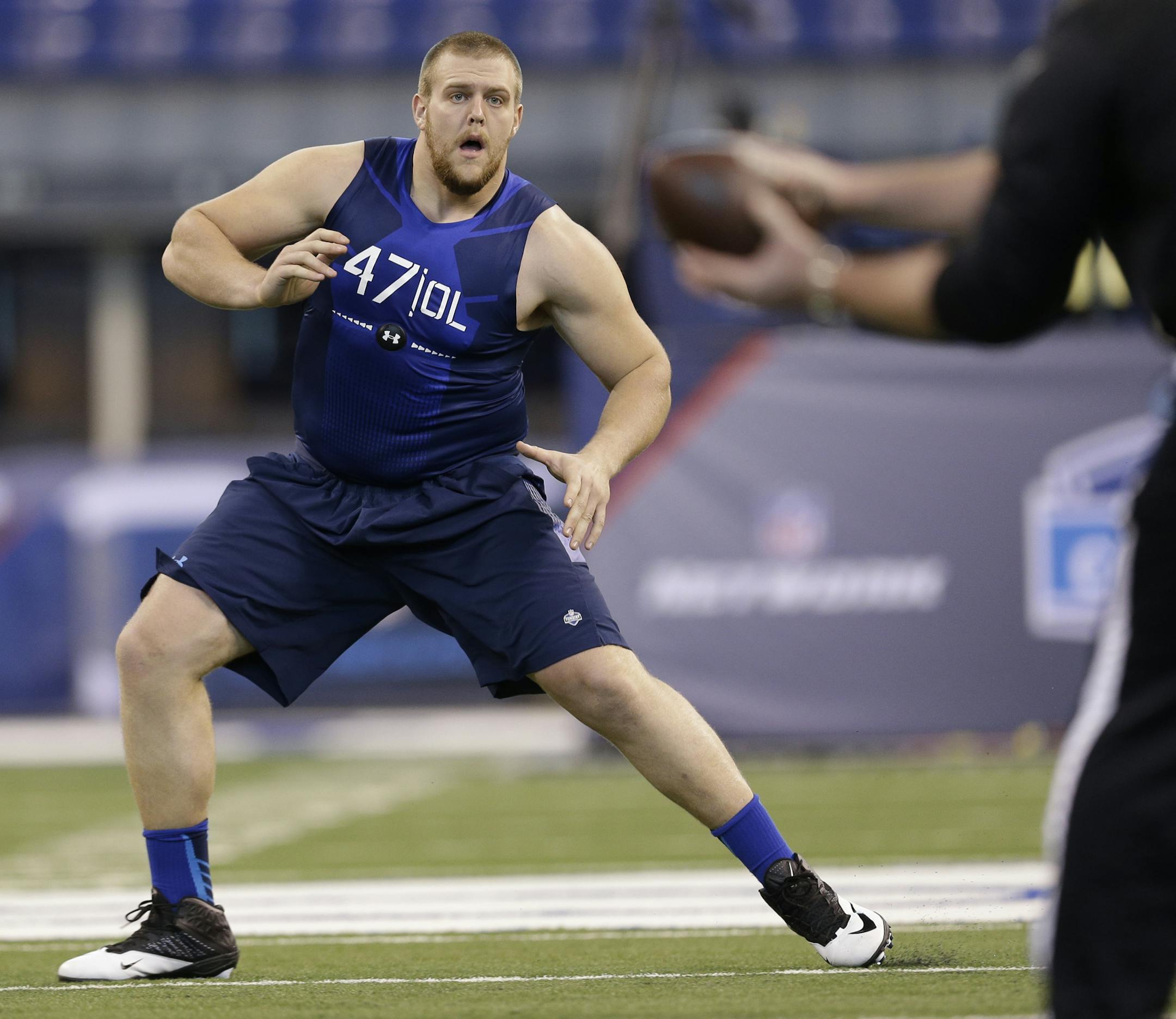 Iowa offensive lineman Brandon Scherff runs a drill at the NFL football scouting combine in Indianapolis, Friday, Feb. 20, 2015. (AP Photo/David J. Phillip)